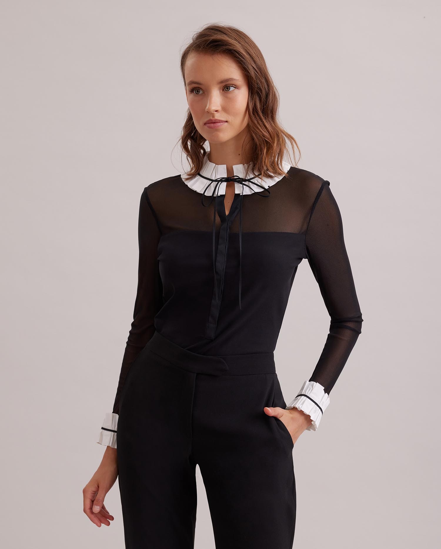 Discover The BEINECKE Black sheer pullover shirt with white poplin ruffle collar and cuffs from ANNE FONTAINE