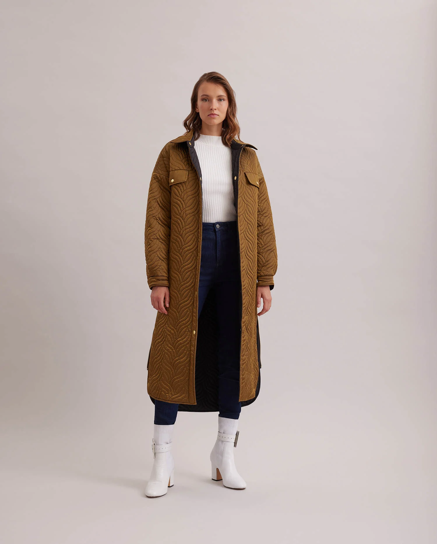 Discover The GENES Reversible Long down coat with wavy geometric top stitch pattern from ANNE FONTAINE