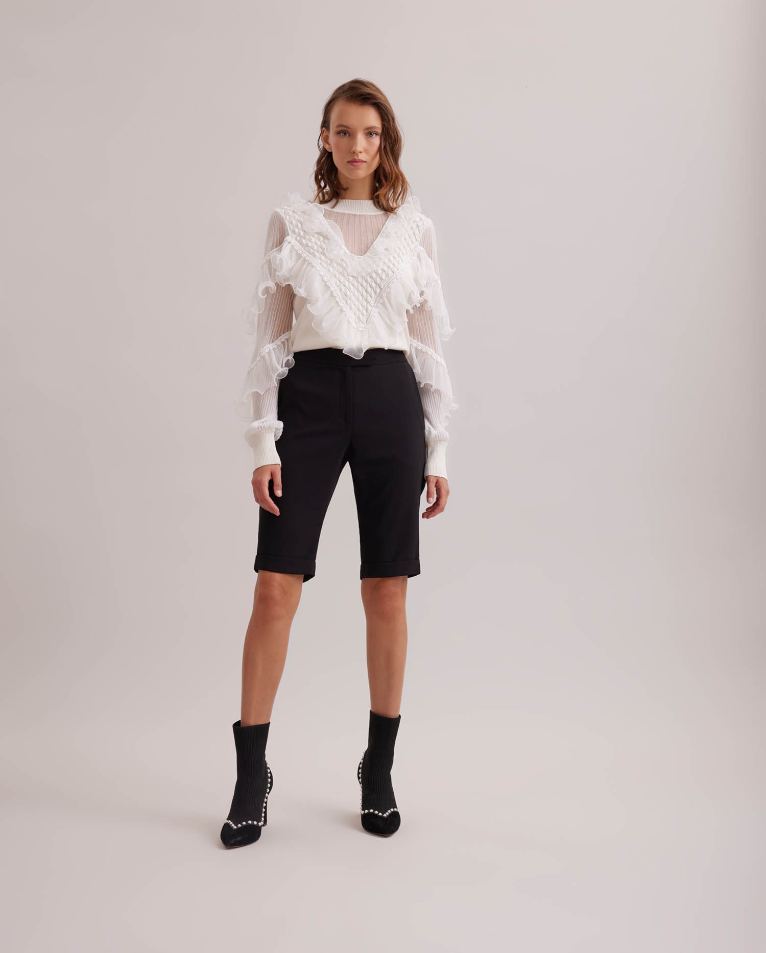 Discover The Mouny Black Bermuda crepe shorts with side pockets from ANNE FONTAINE