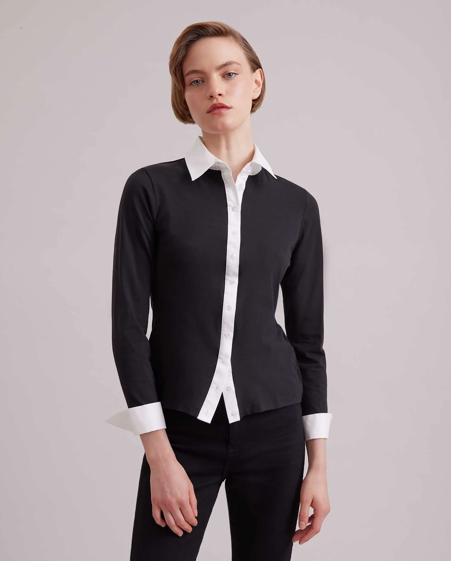 Discover The NUAGE Long sleeve black jersey shirt with contrasting white collar and cuffs from ANNE FONTAINE