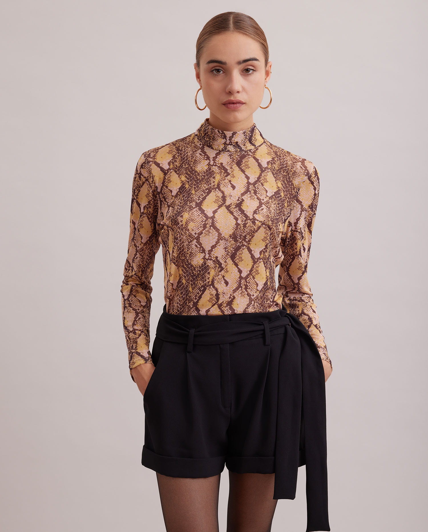 Discover the PAGES Long sleeve mock neck sheer snake pattern top from ANNE FONTAINE