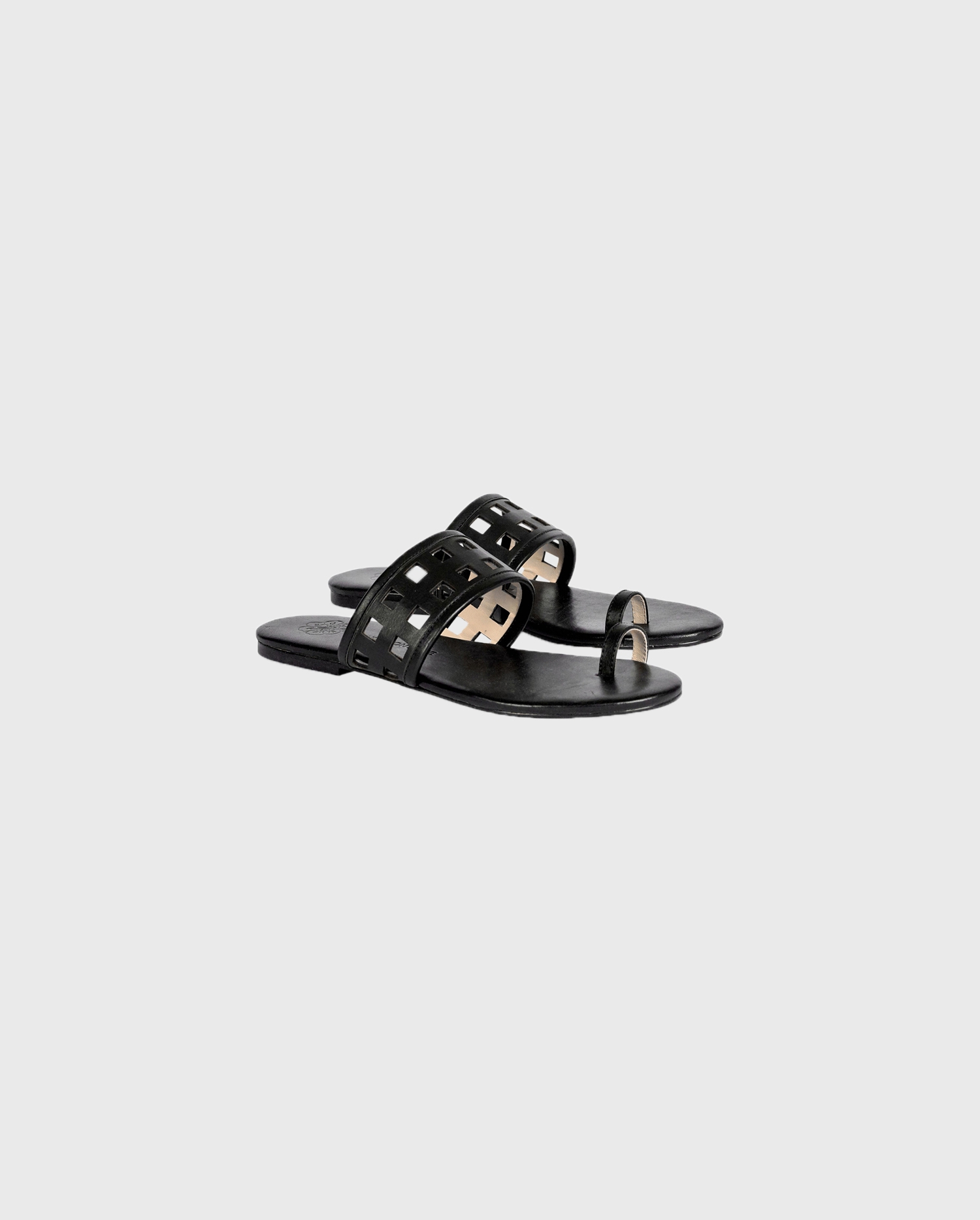 Discover The TOBY Flat Black Sandals With Geometric Laser-Cut Straps From ANNE FONTAINE