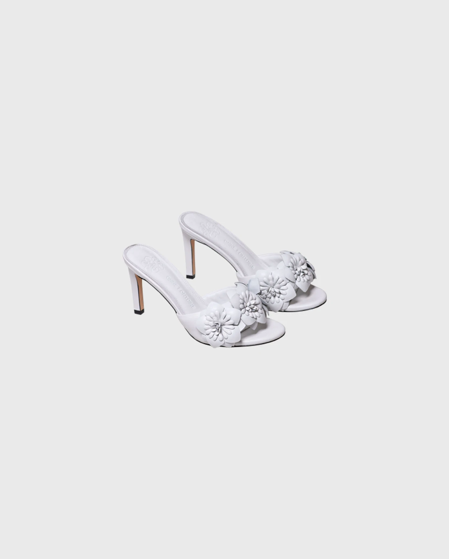 Discover the CAMOMILLE White Leather Sandal Heels With 3D Flowers from ANNE FONTAINE