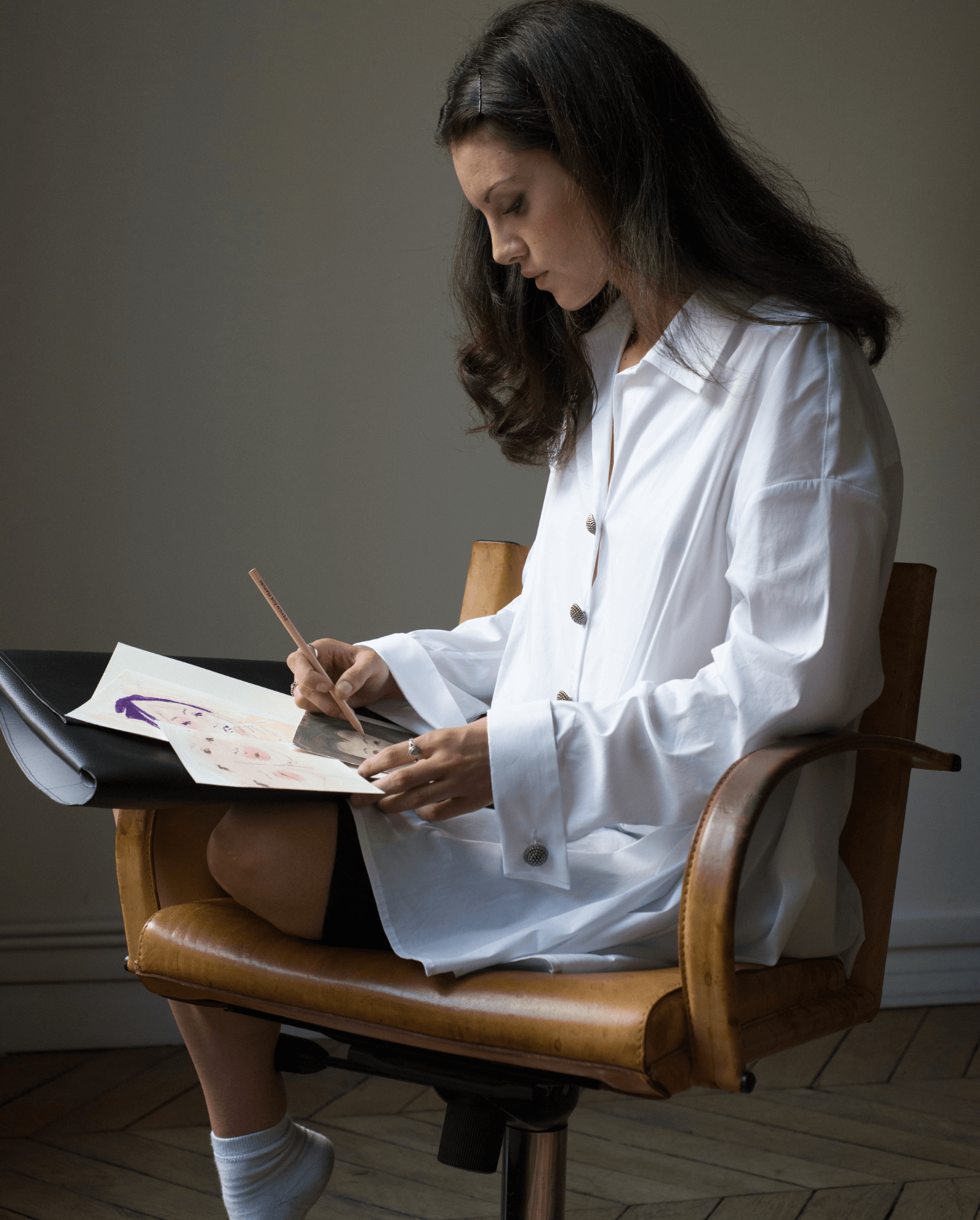 Discover the SORBONNE White tunic length baby doll shirt with ornate buttons from ANNE FONTAINE