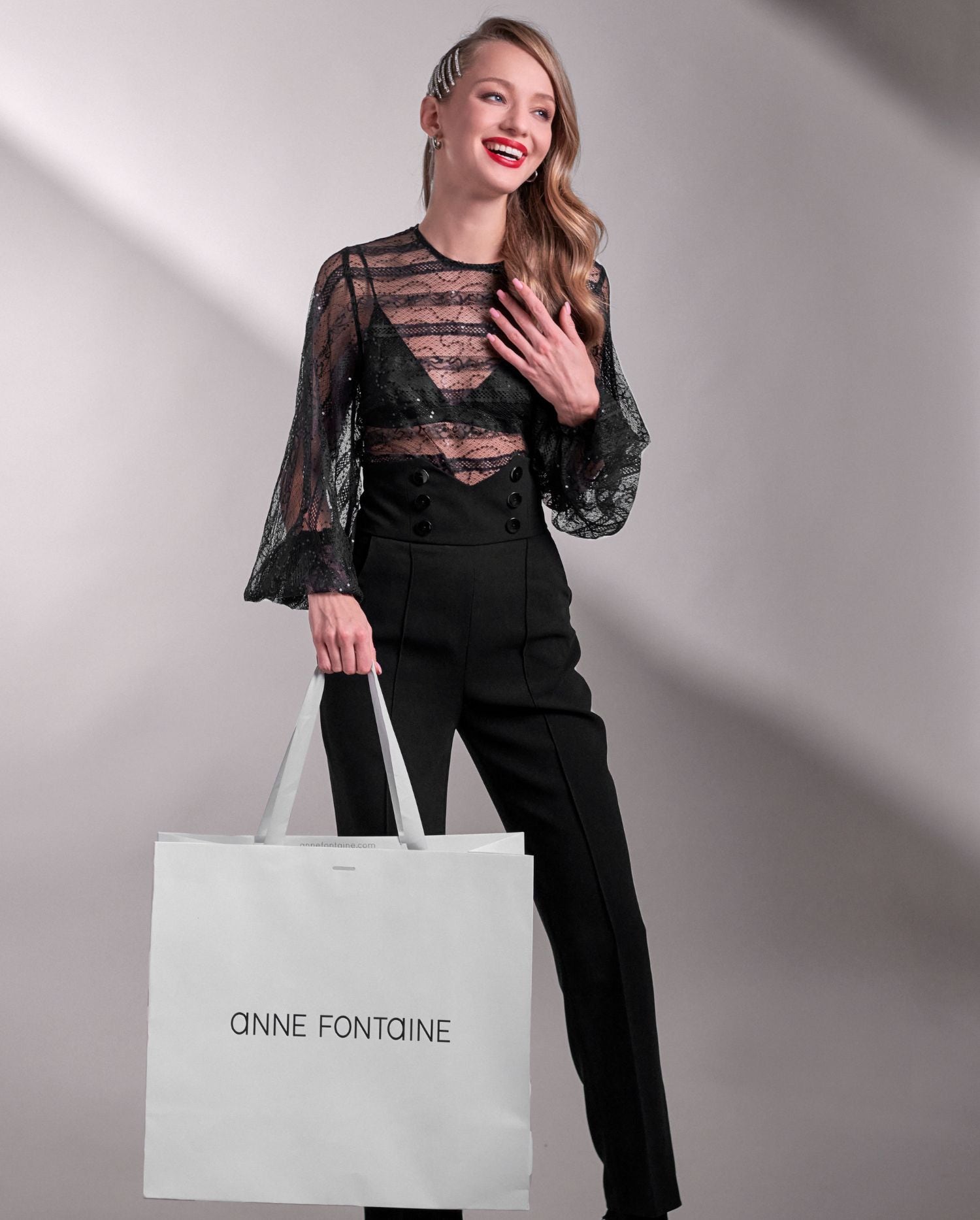 Discover the ROMANTIC Sheer black lace blouse with a lattice horizontal detail and tonal sequins