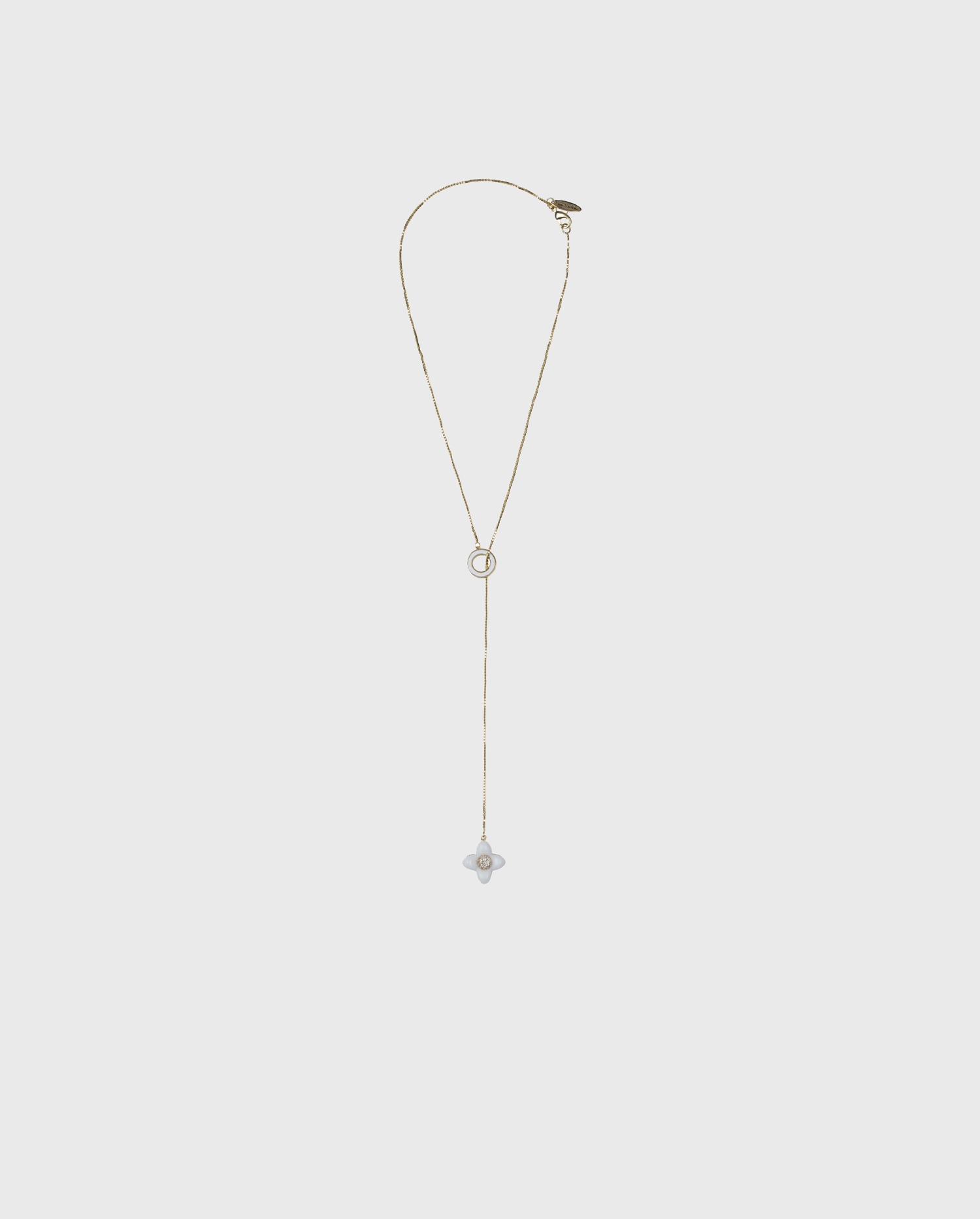 Disocver the IRI Minimalist gold chain necklace with white flower charm from ANNE FONTAINE