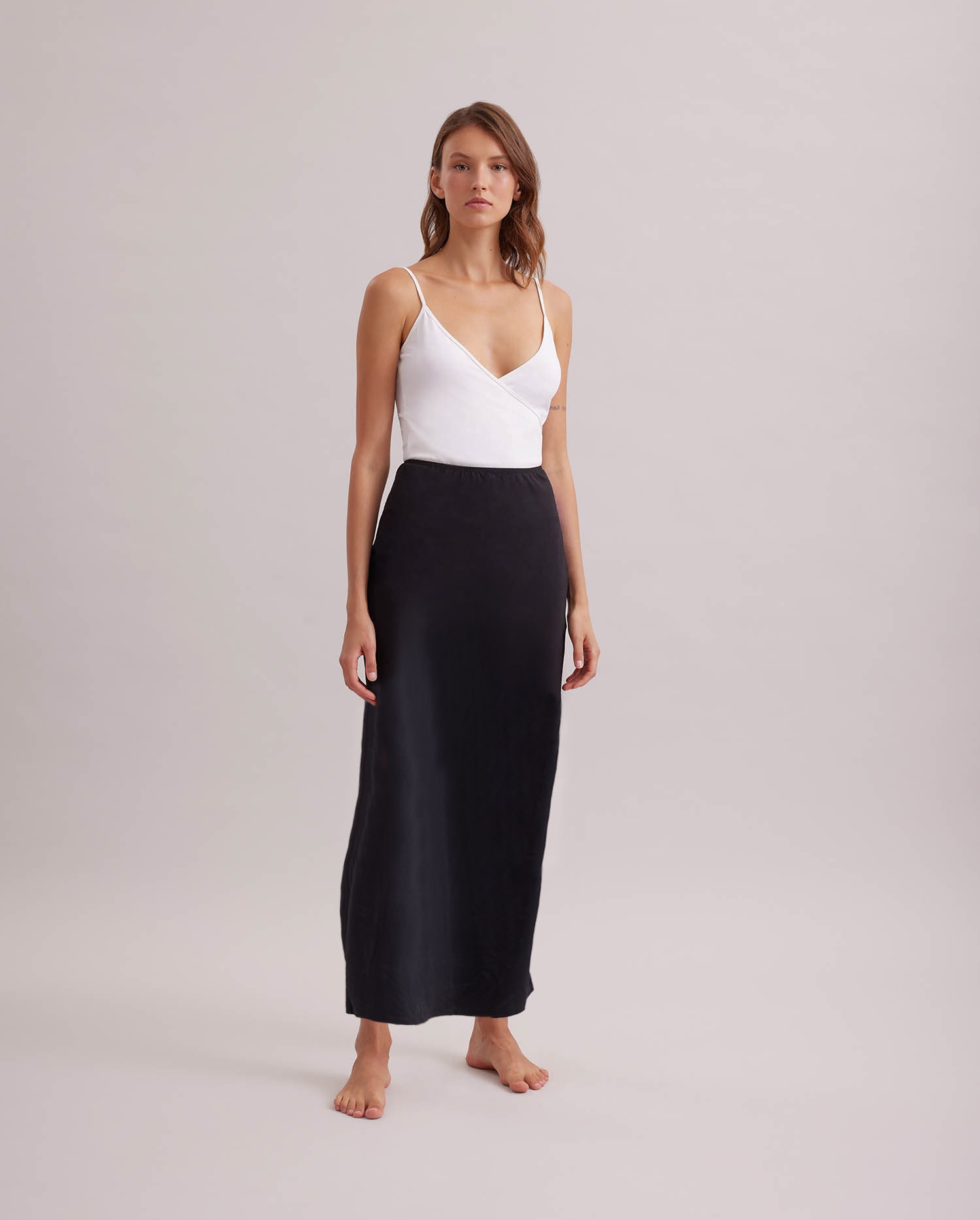 Discover The NOVELA long black maxi skirt from ANNE FONTAINE