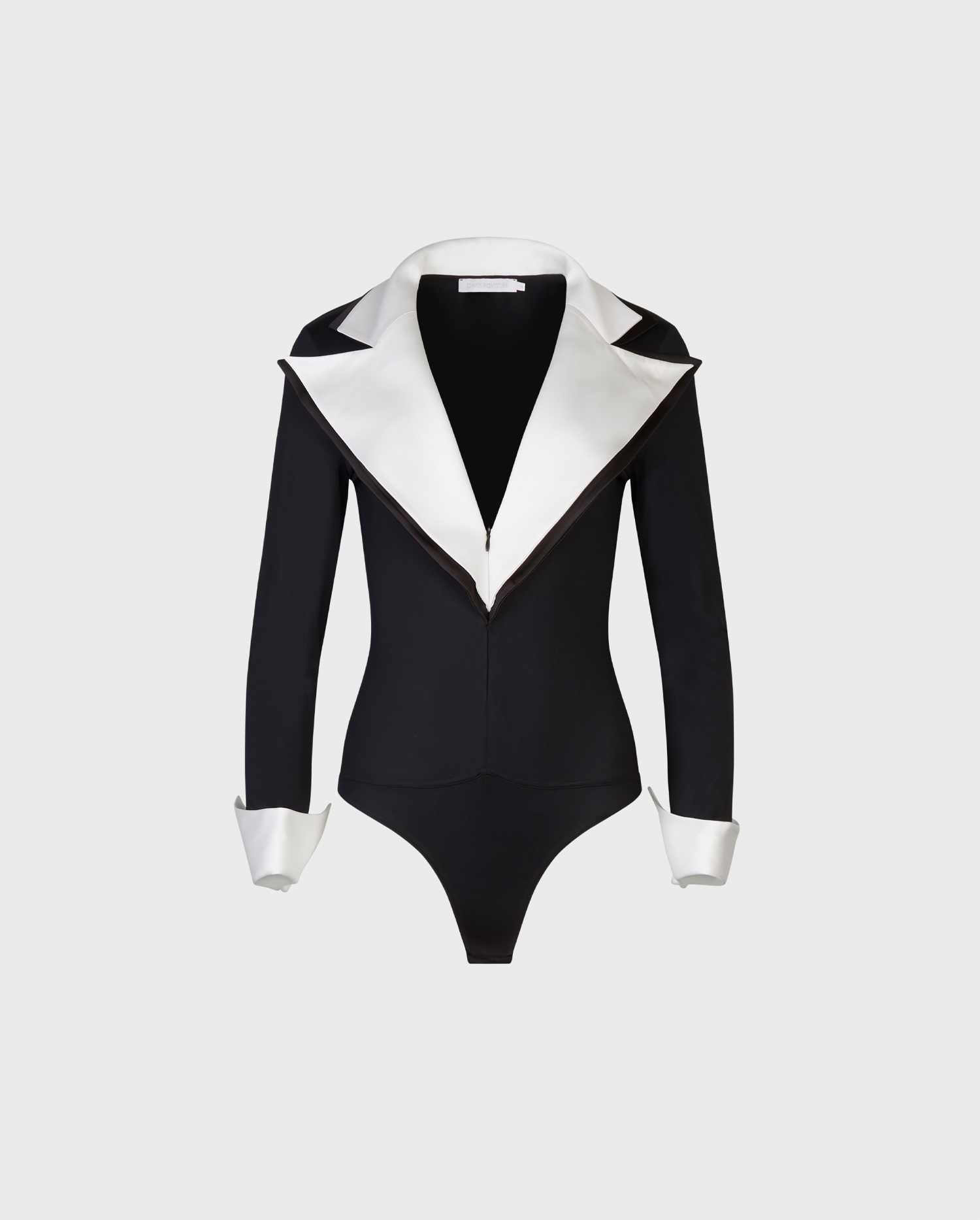 Discover the POLAR Black bodysuit with white oversized lapel and french cuffs from ANNE FONTAINE