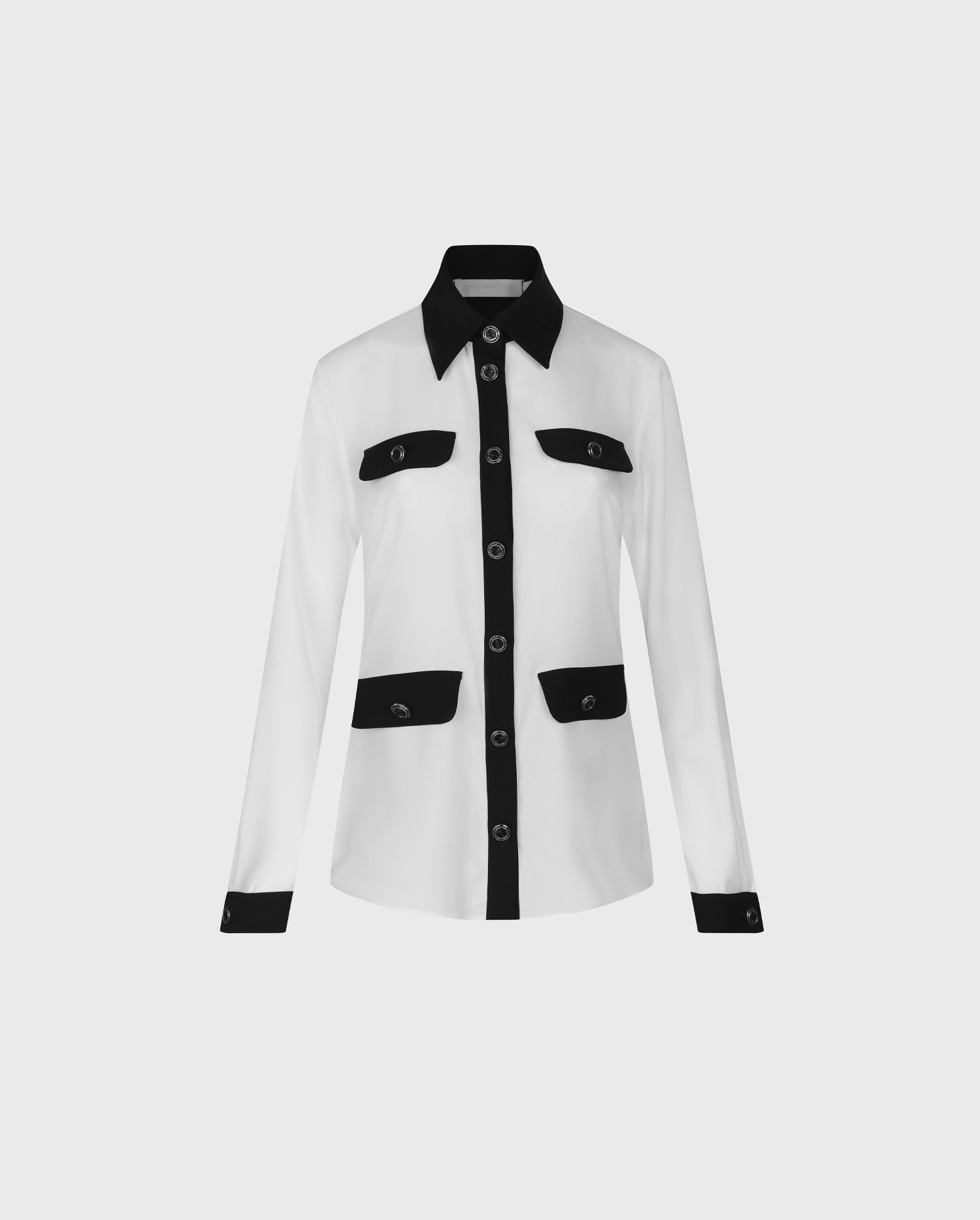 Discover the SANDEAU Long sleeve white shirt with black contrast trims and large button details from ANNE FONTAINE