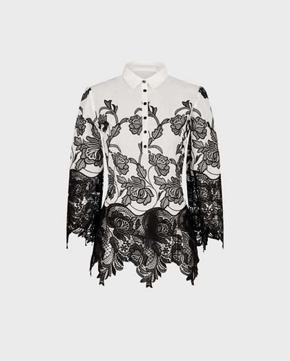 Explore the black and white VIZANE top for a look of modern luxury.