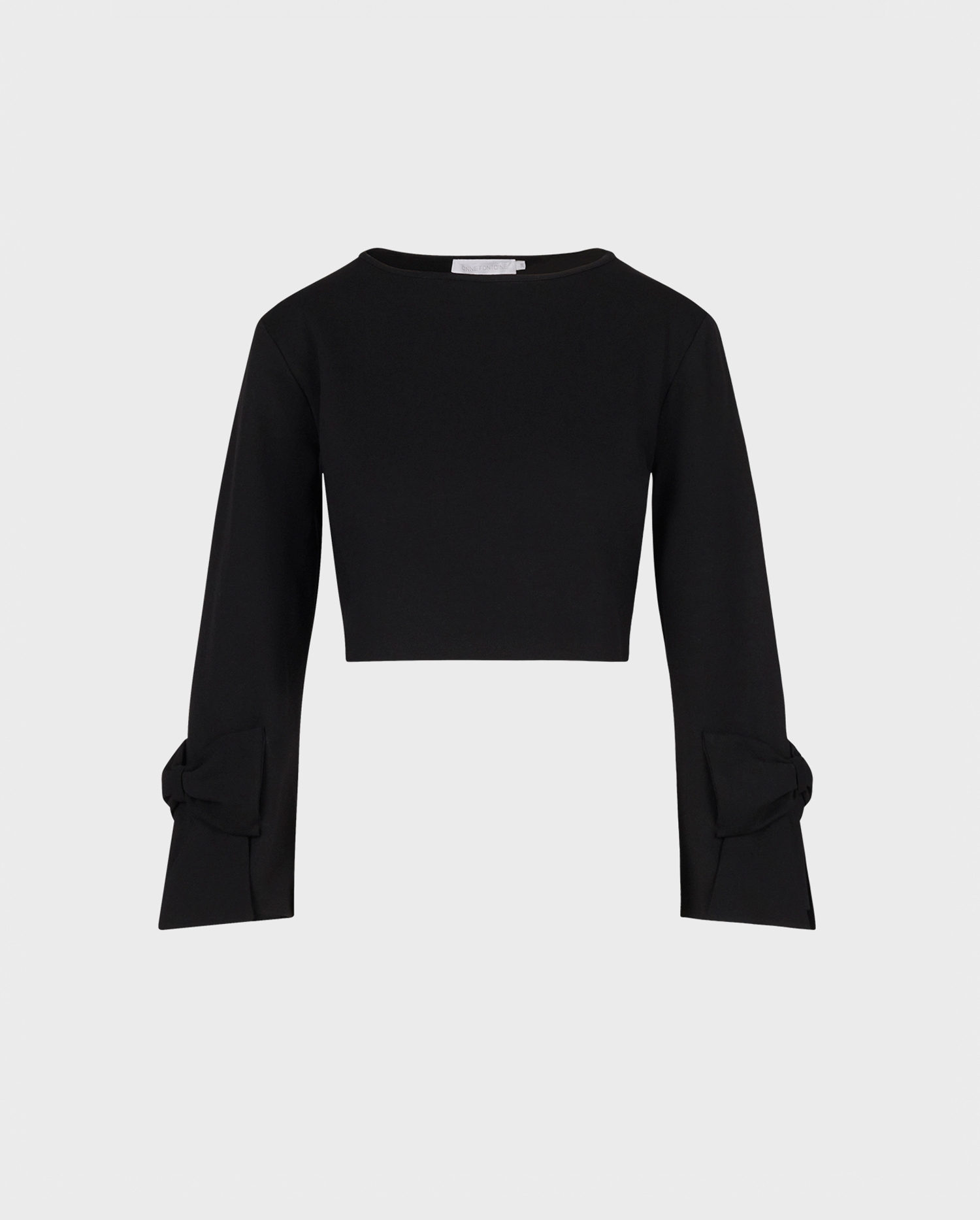 Discover The TWIST Cropped sweater in black featuring oversized statement bows from ANNE FONTAINE