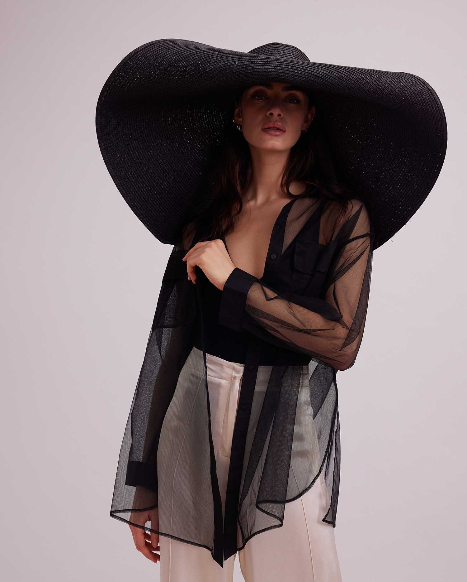 Discover the BRASILIA Sheer Black Oversized Shirt With Front Flap Pockets