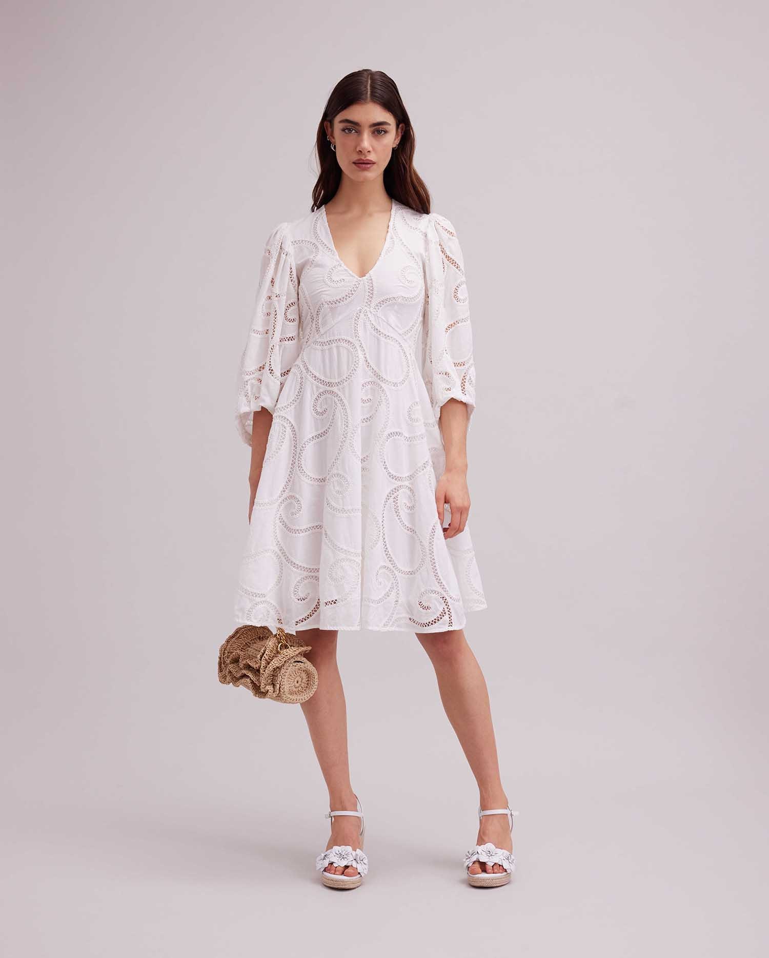 Discover the ESTIVAL White 3/4 Sleeve Dress With Paisley Eyelet Design