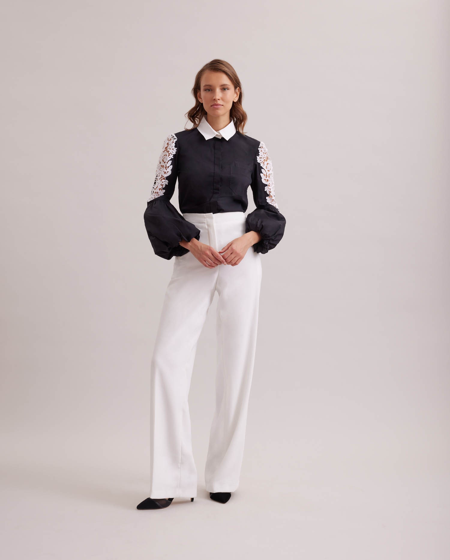 Discover The LAORA black balloon sleeve shirt with intricate floral embroidery from ANNE FONTAINE
