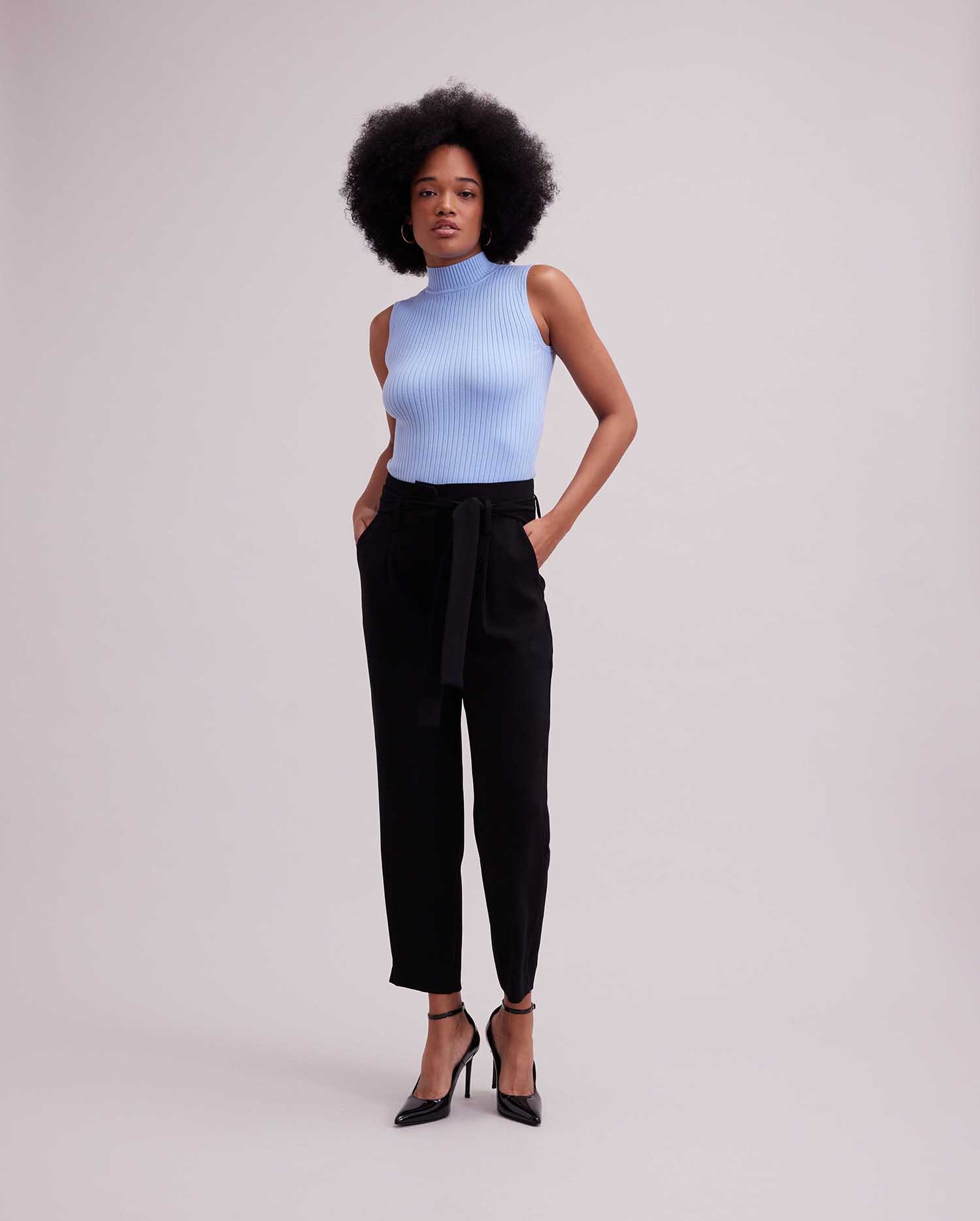 Discover the SOLO Sleeveless Light Blue Ribbed Mockneck Knit