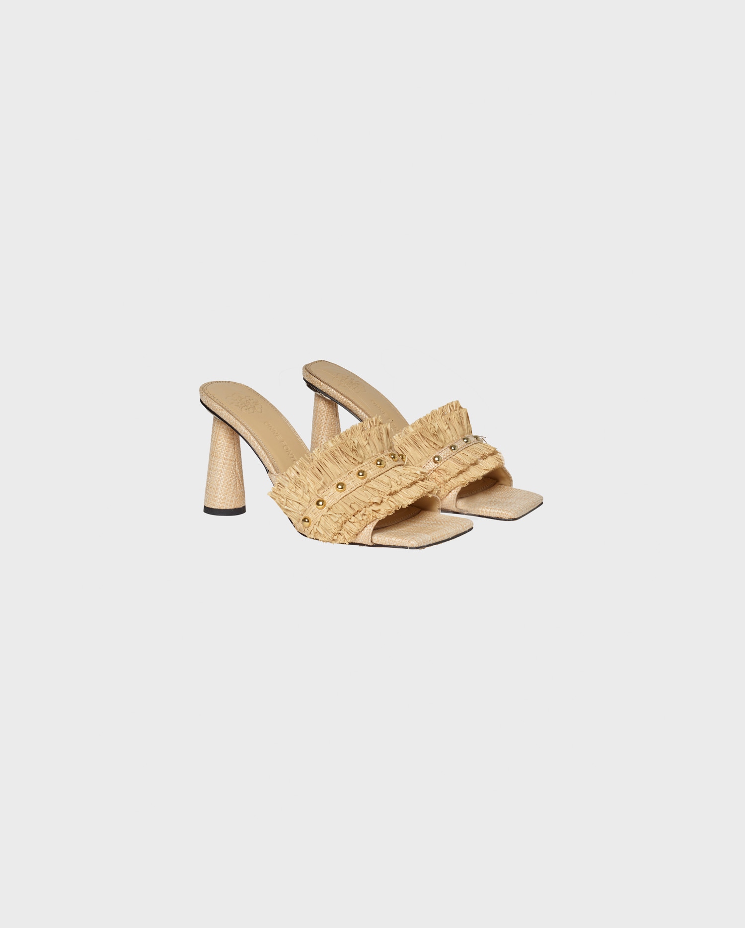 Discover the ALVAR Natural Leather Slides With Raffia Ruffle Details from ANNE FONTAINE