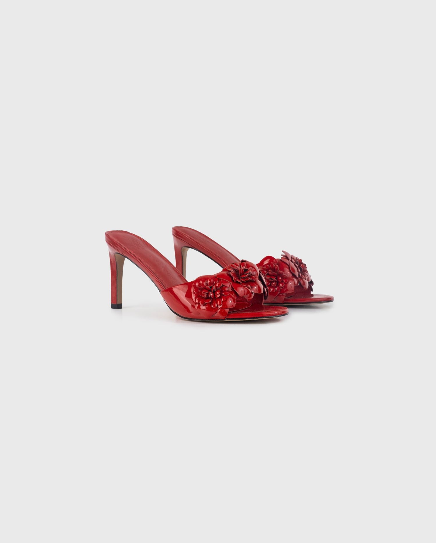 Discover the CAMILLA Red Leather Slip on Heel With Flowers