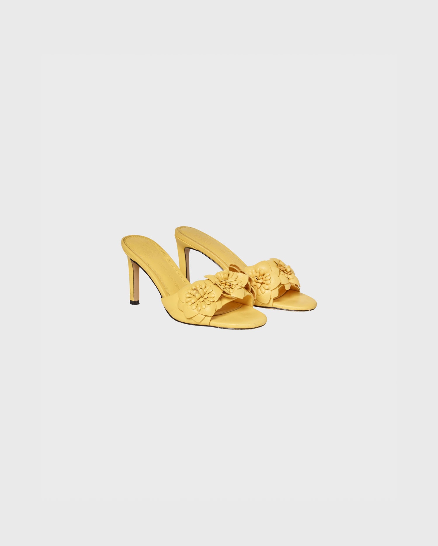 Discover The CAMOMILLE yellow leather sandal heels with 3D flowers from ANNE FONTAINE