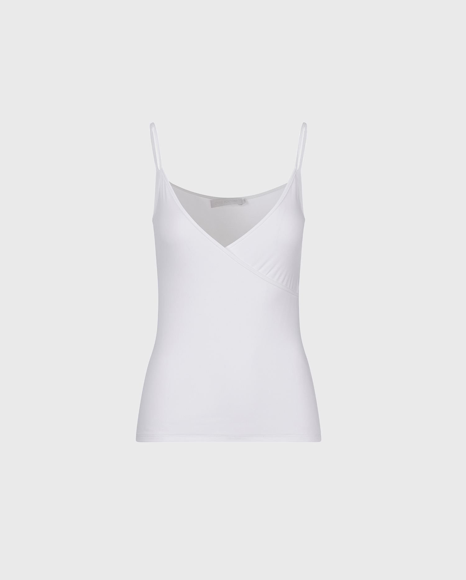 Discover the CINA White Thin Strap Lightweight Camisole
