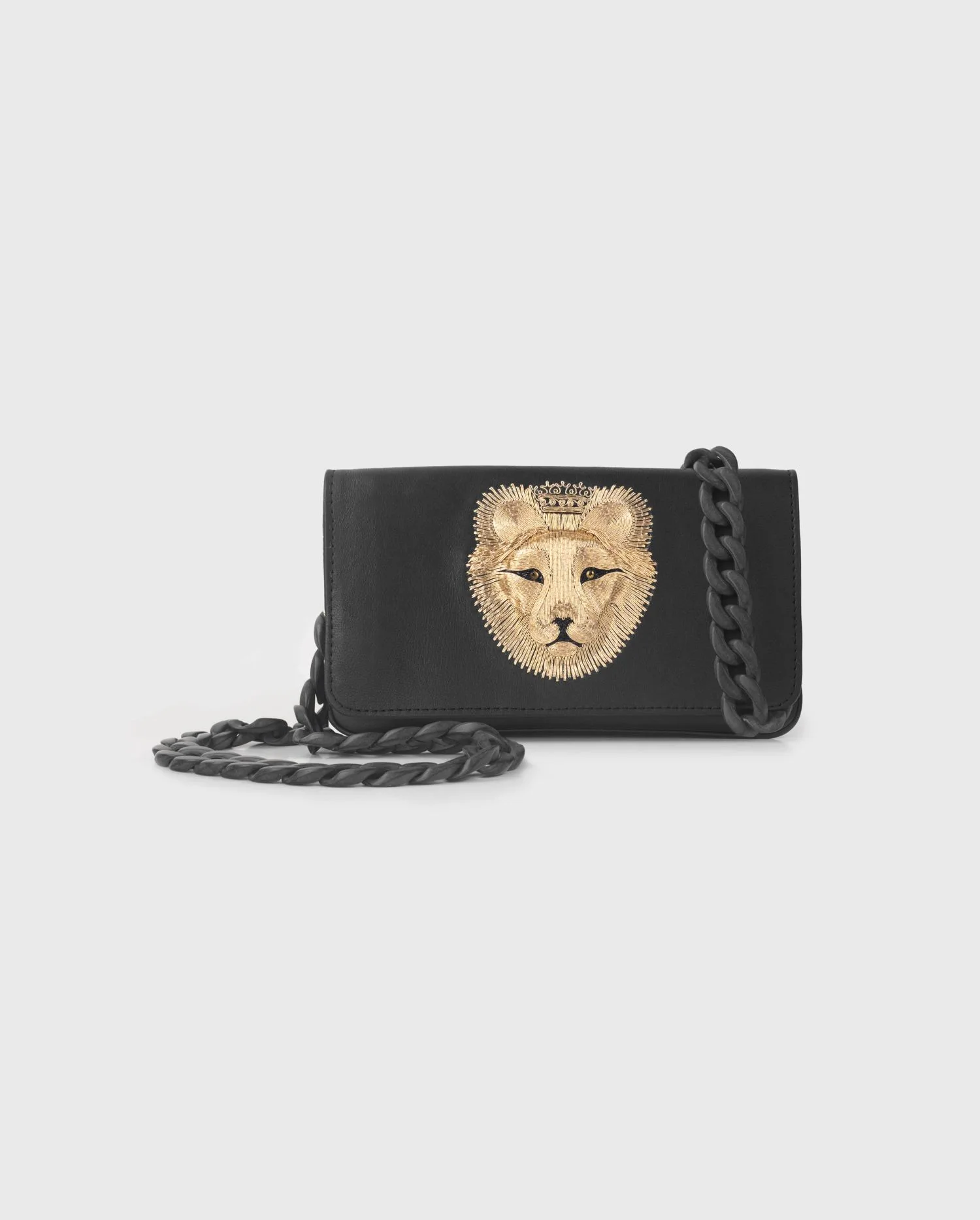 Disocver the CURIOUS black leather clutch handbag with gold lion emblem from ANNE FONTAINE