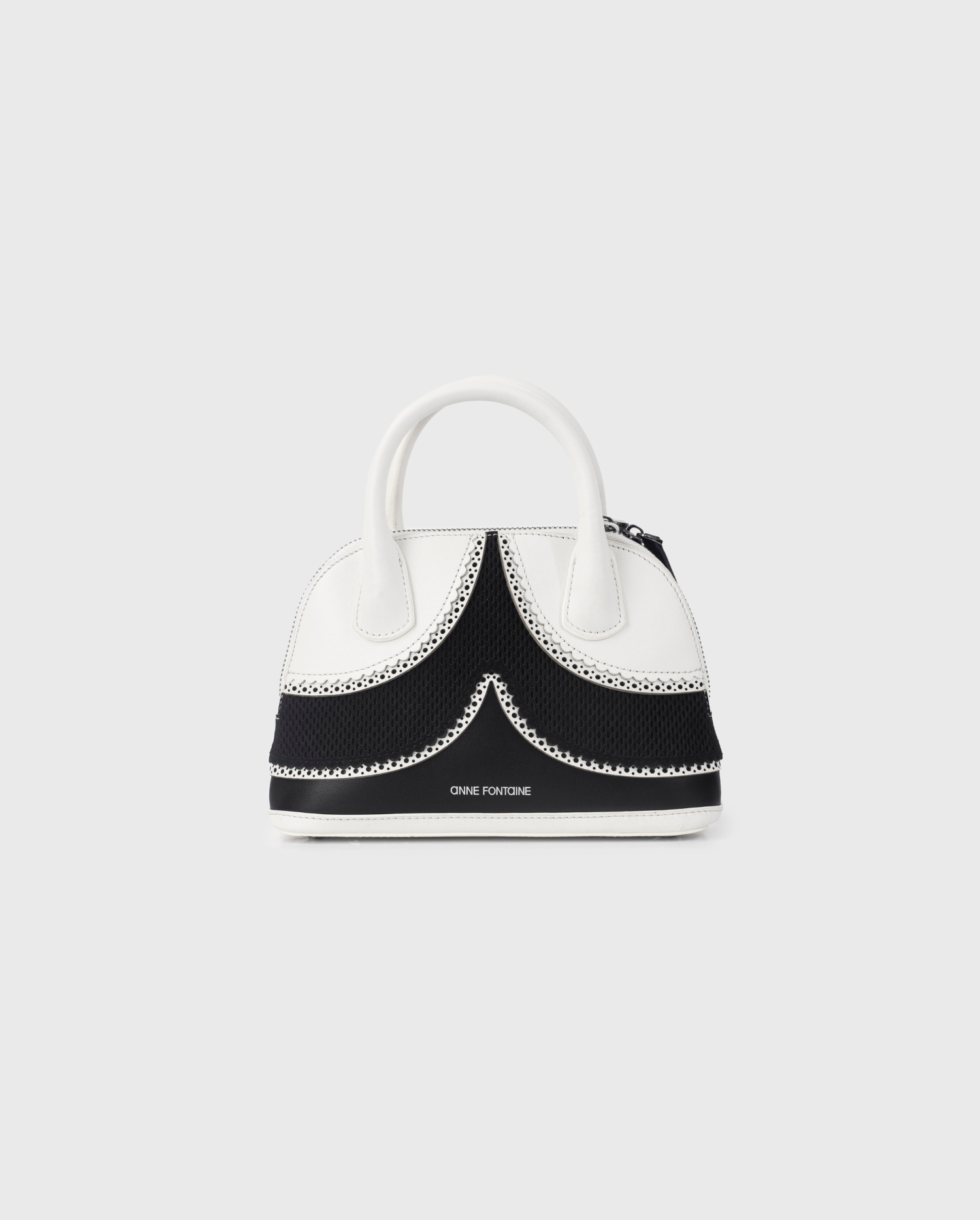 Discover the JANAE Black and White Leather Handbag With Eyelet Trims from ANNE FONTAINE