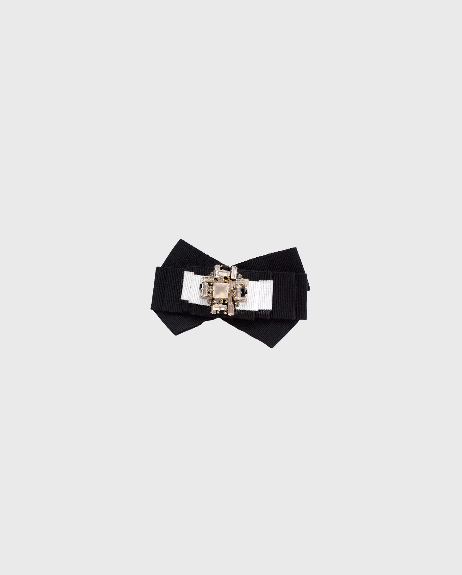 Discover the OPAMA bow shaped brooch from ANNE FONTAINE