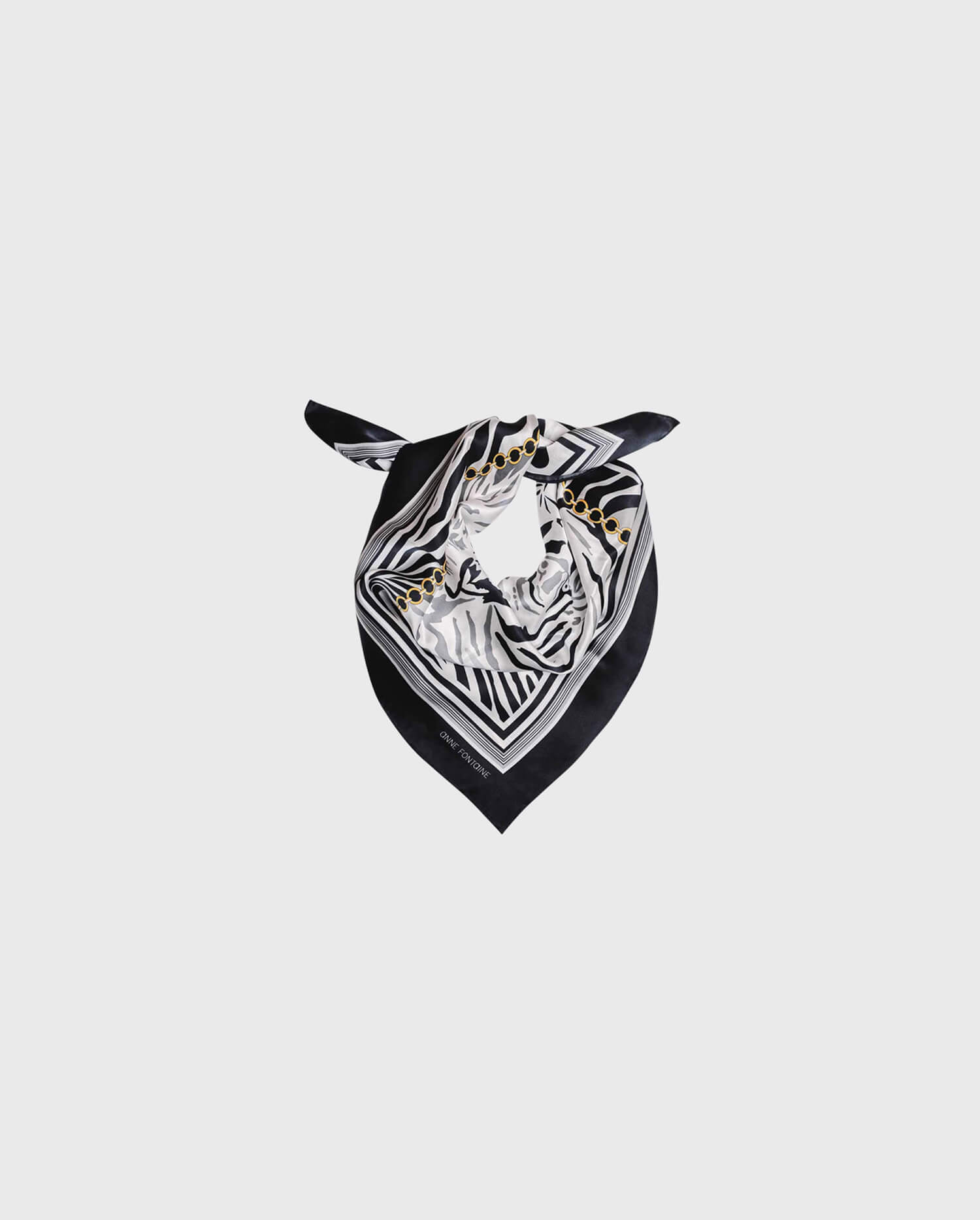 Discover the TERENE Zebra Print Silk Scarf in Black and White