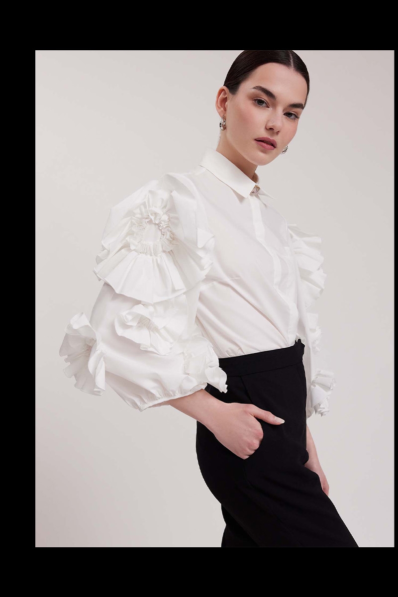 Discover the ISADORA White 3/4 Sleeve Shirt With 3-D Ruffled Flowers from ANNE FONTAINE