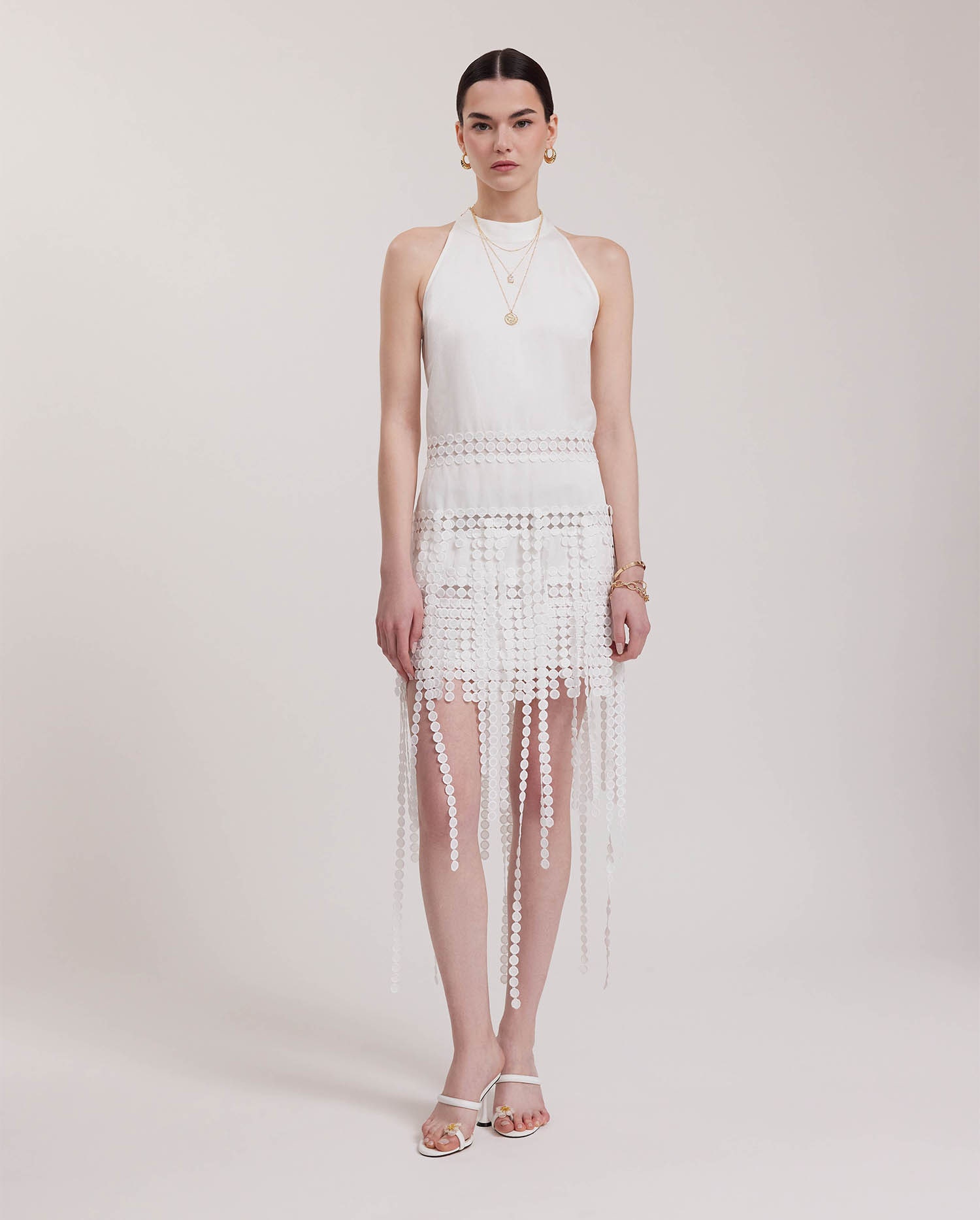 Discover the ALTHEA White Halter Cut Fringe Dress With Circle Lace Inserts from ANNE FONTAINE