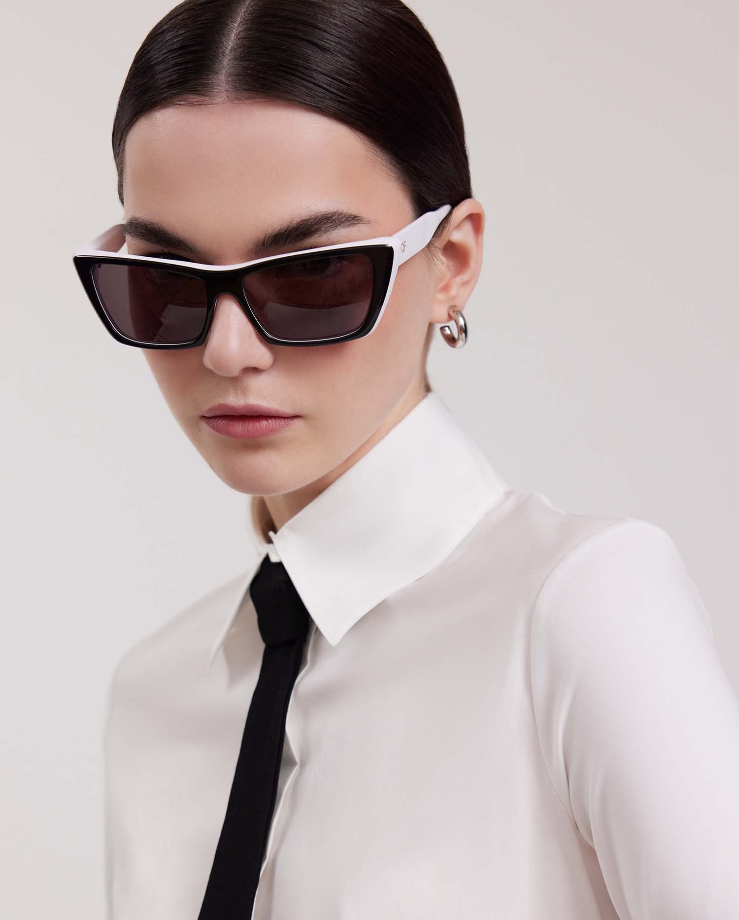 Discover the HERA Black and White Retro Cat Eye Sunglasses from ANNE FONTAINE