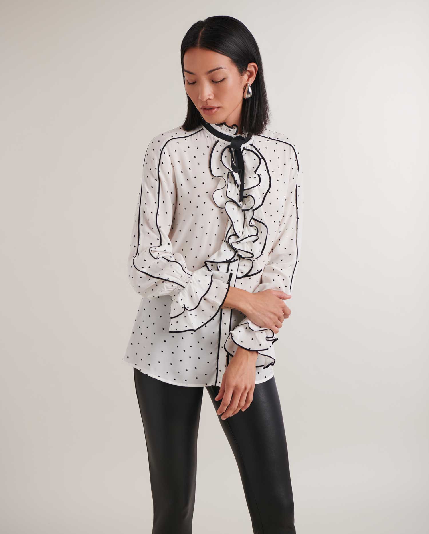 Elevate your style to new heights with designer Anne Fontaine's extraordinary collection of shirts and blouses. 