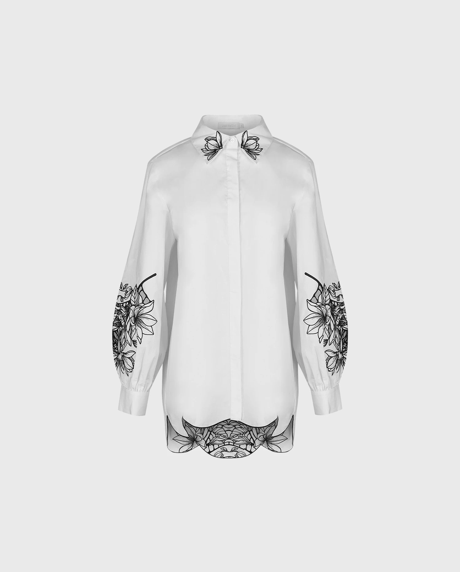 Discover the LEONIE White Long Sleeve Cotton Poplin Shirt With Black Embroidered Flowers from designer ANNE FONTAINE