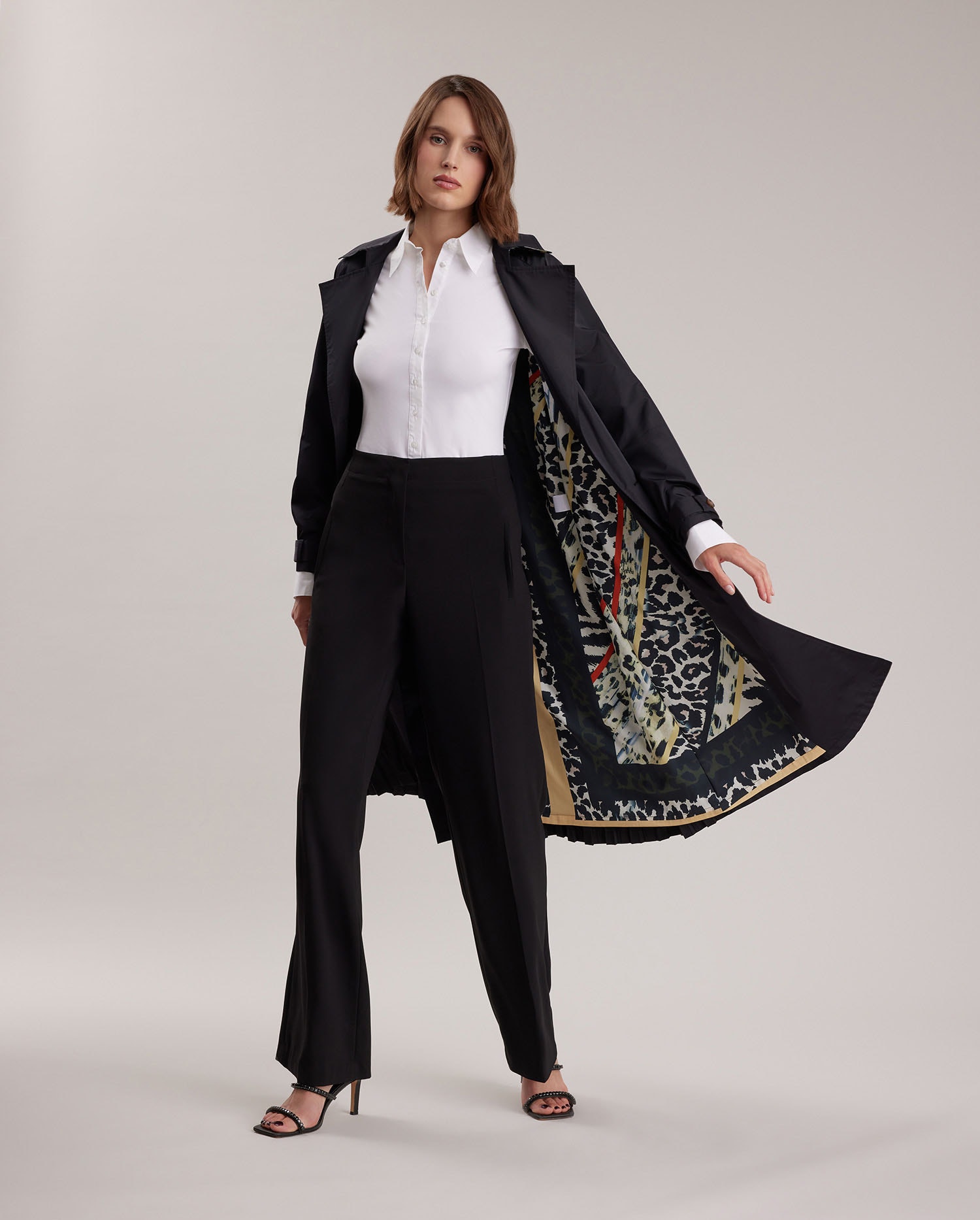 Discover the NORA Black Classic Trench Coat With Silk Leopard Print Lining