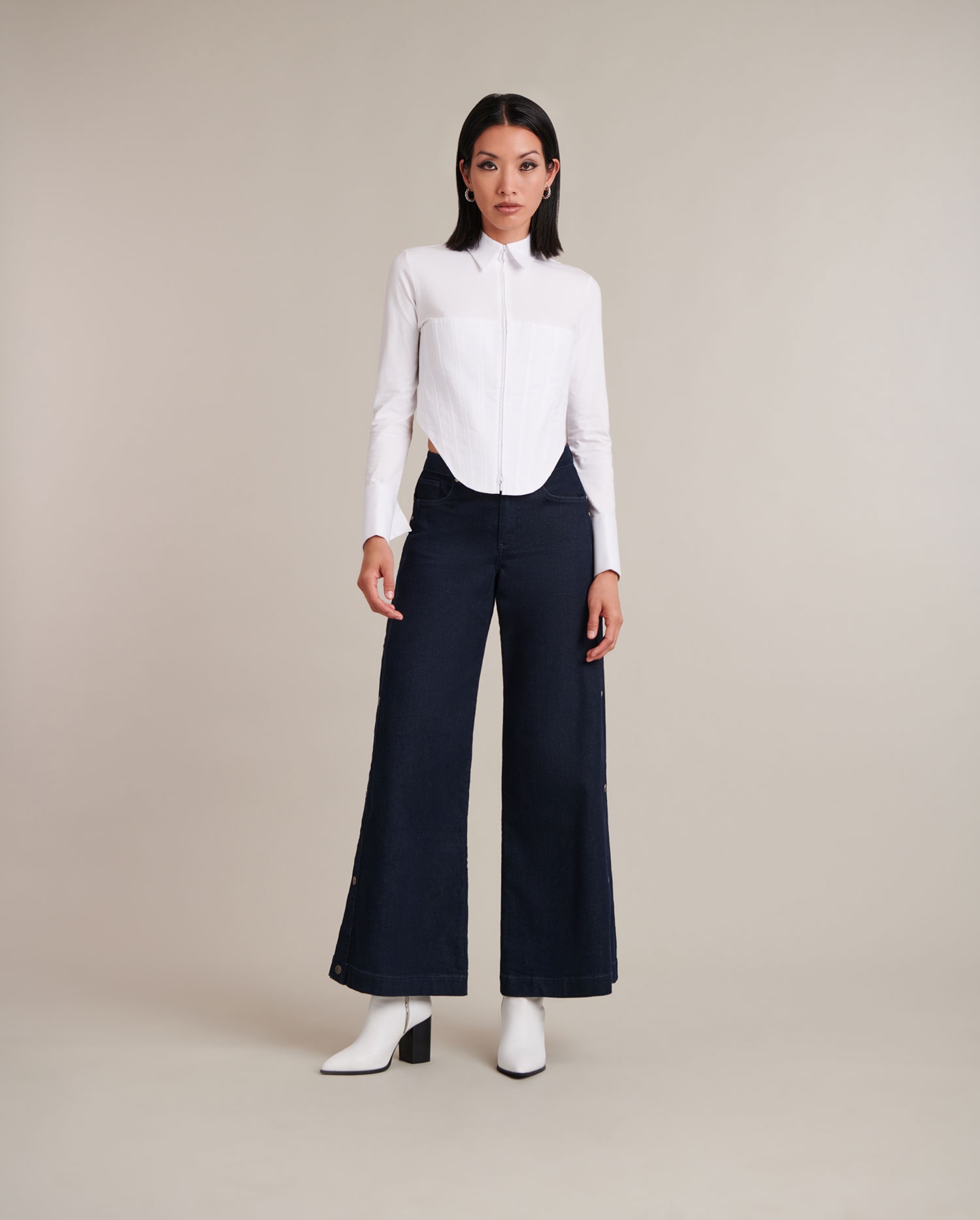 Discover the EDDIE White Long Sleeve Zip Up Jersey Knit Shirt With Pique Corset Body