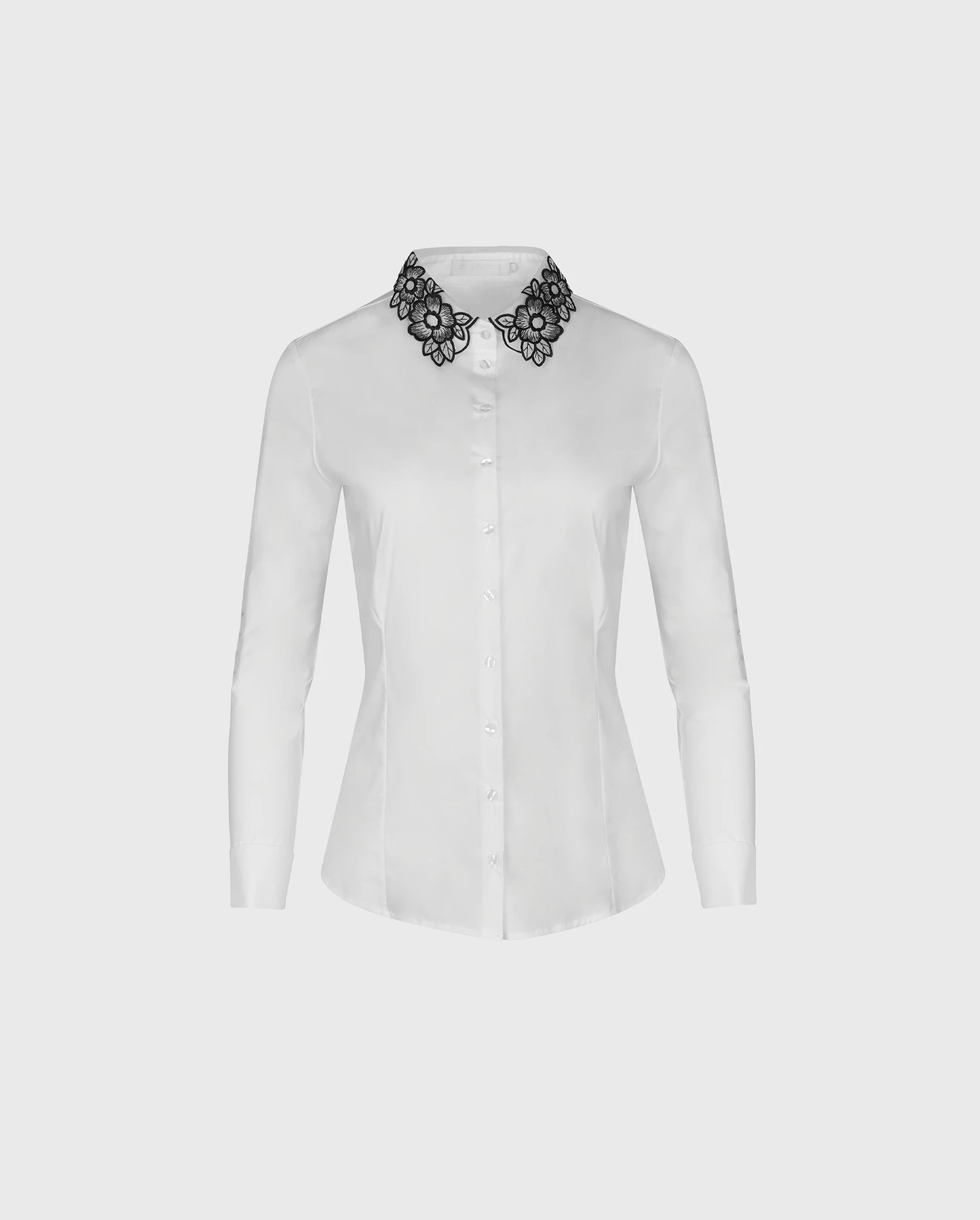 Discover the RECUEIL White Long Sleeve Shirt With Black Floral Embroidered Collar from designer ANNE FONTAINE