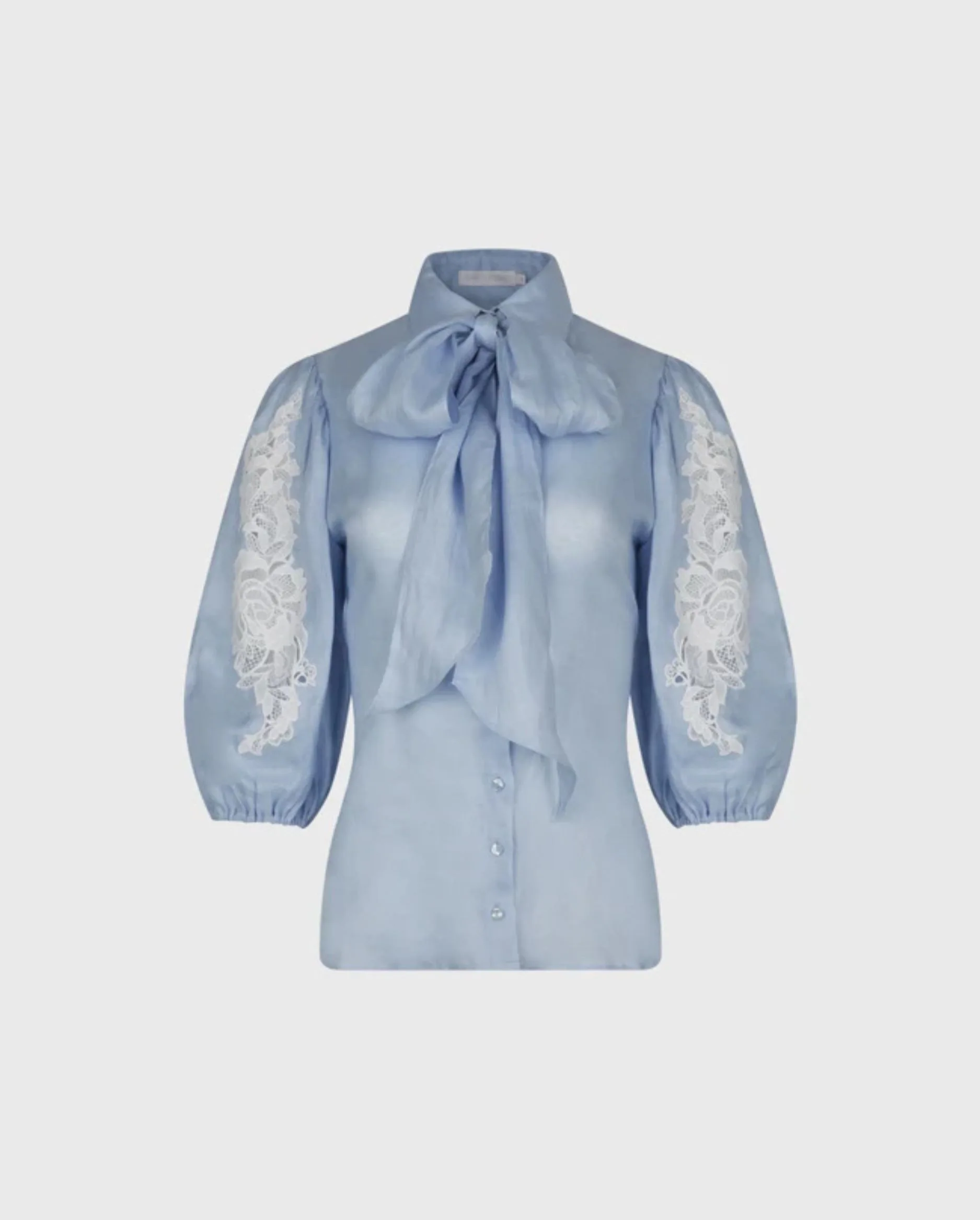 Discover the ABBIE Light Blue Balloon Sleeve Linen Shirt With Lace Inserts and Removable Neck Tie by designer ANNE FONTAINE