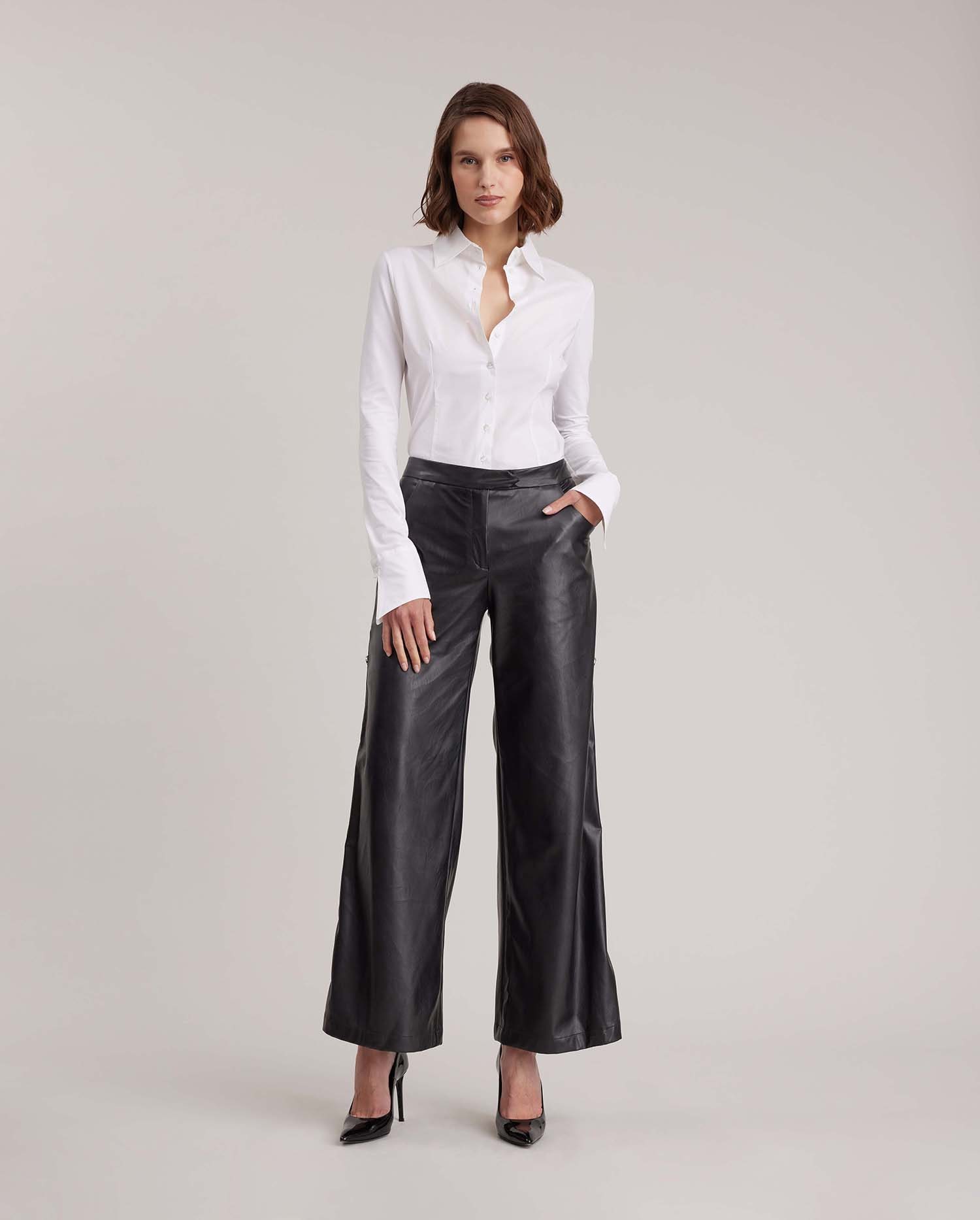 Discover the Esthete Wide Leg Faux Leather Pant Featuring Side Snap Details from designer ANNE FONTAINE