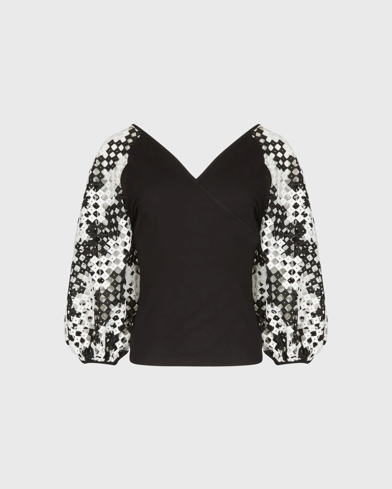 Discover the MIRELLA Black Jersey Faux Wrap Top With Black & White Geometric Jacquard Stripe Balloon Sleeves by designer ANNE FONTAINE