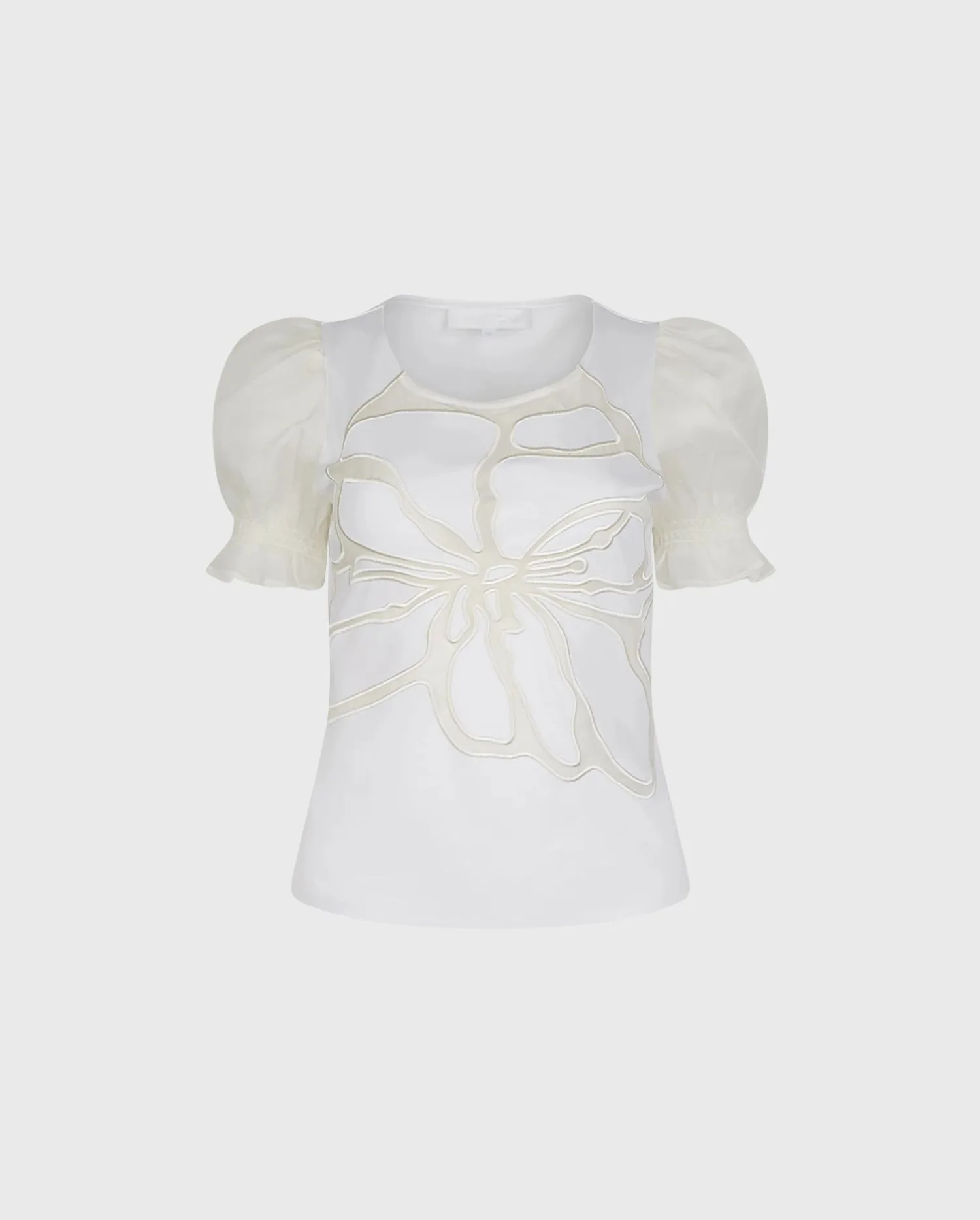 Discover the NEERA White Short Sleeve Pullover Top With Sheer Mesh Sleeves and Sheer Embroidered Floral Design by designer ANNE FONTAINE