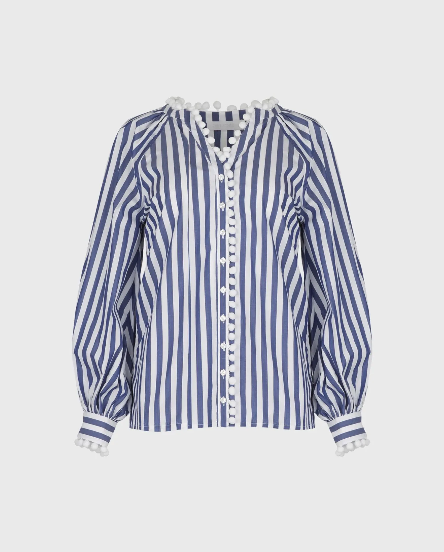 Discover the Nelli Blue and White Thin Striped Poplin Shirt With Pom-Pom Embellished Neckline and Front Placket from designer ANNE FONTAINE