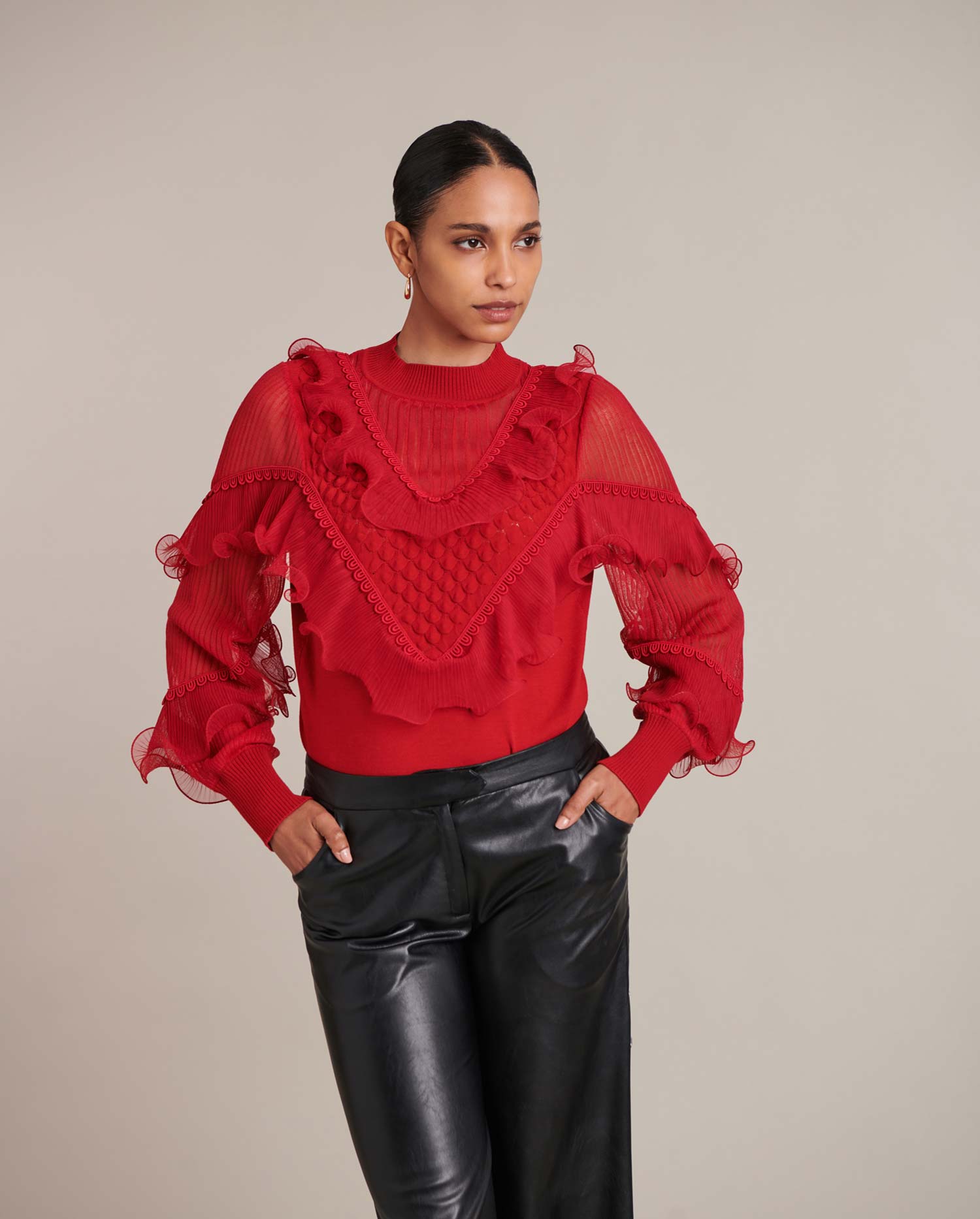 Discover the Oeuvre Long Sleeve Red Pullover Knit with Sheer Details and Cascading Ruffles from designer ANNE FONTAINE