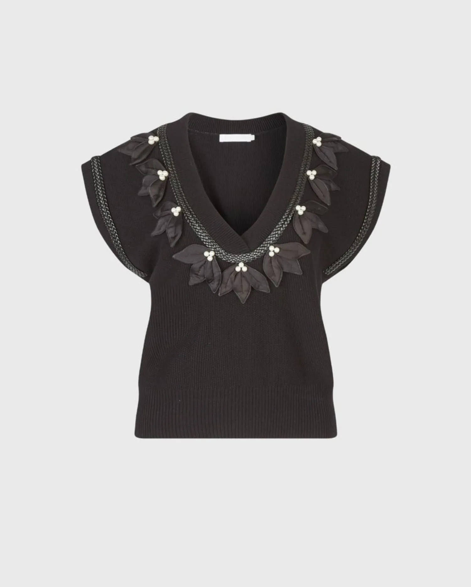 Discover the JORDAN Black Pullover Vest with Pearl & Satin Leaf Details by designer ANNE FONTAINE
