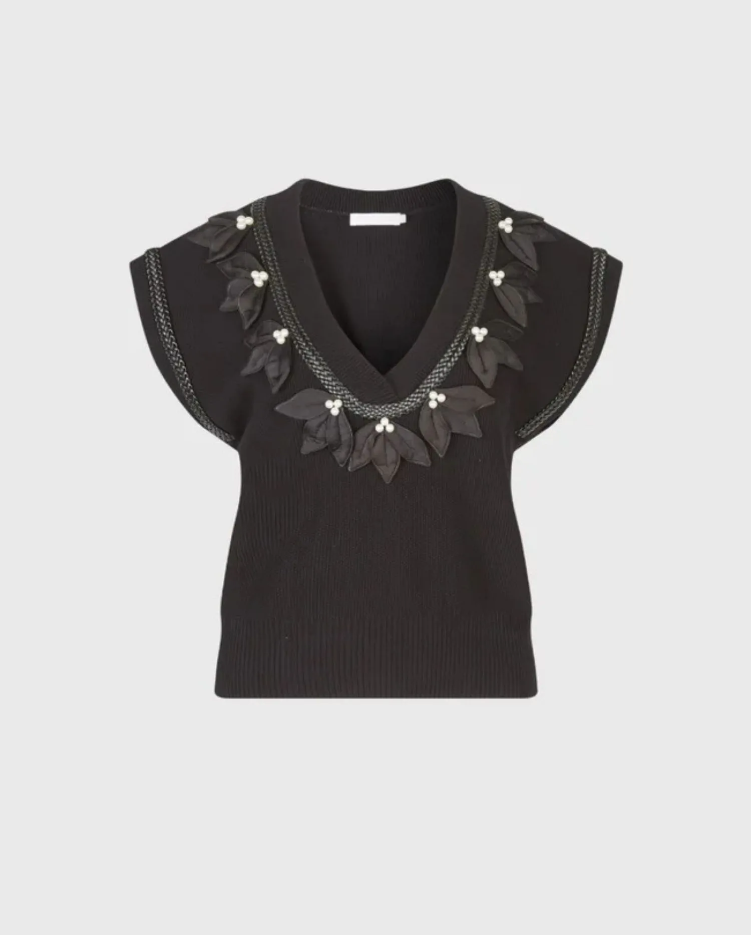 Discover the JORDAN Black Pullover Vest with Pearl & Satin Leaf Details by designer ANNE FONTAINE