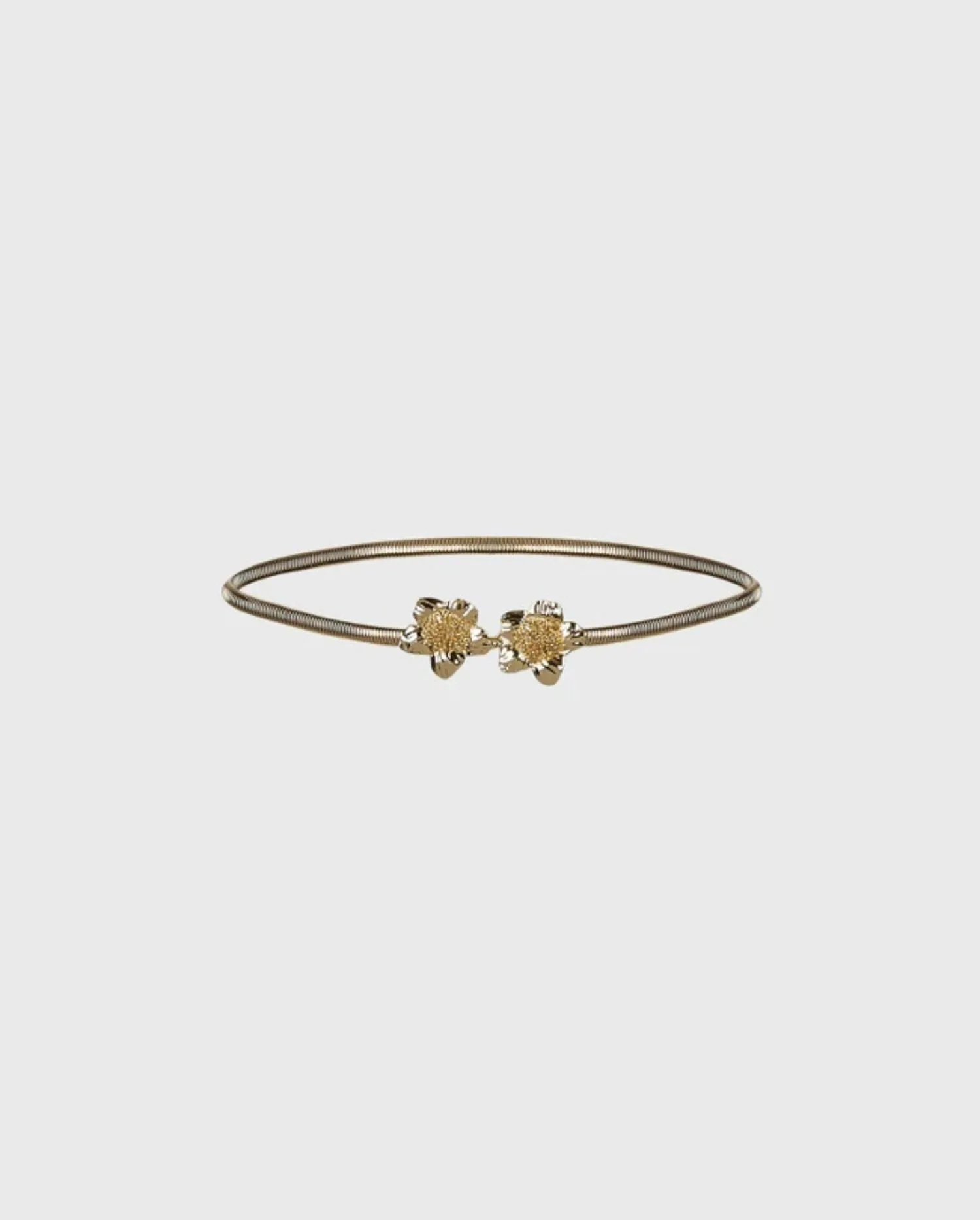 Discover the ADELE Gold Thin Metal Belt With Double Flower Hook Clasp by designer ANNE FONTAINE