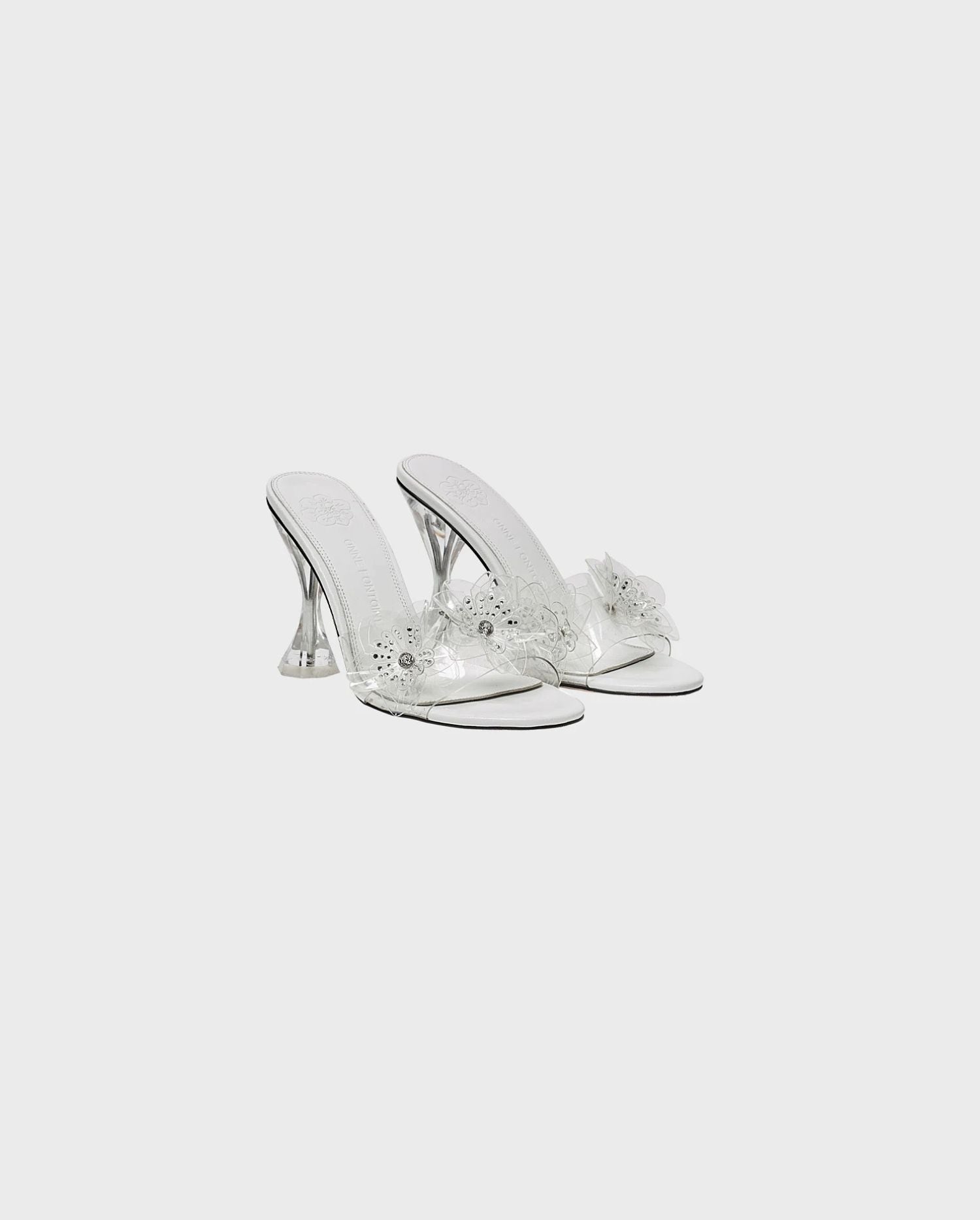 Discover the Ayala Leather Sandal Heels With Clear Front Strap & Rhinestone Floral Details from designer ANNE FONTAINE