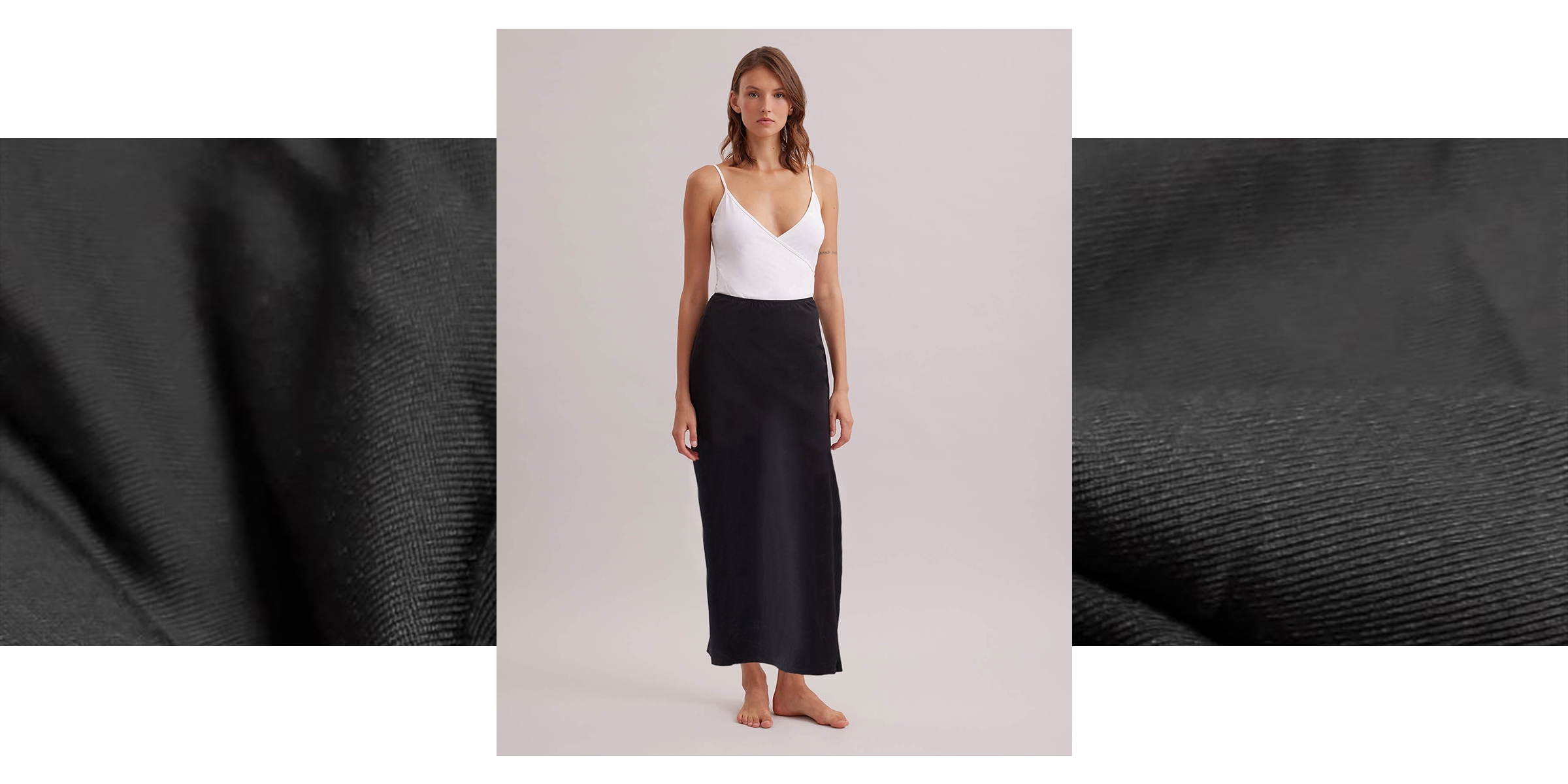 Discover the NOVELA Longline Black Tactel Maxi Skirt