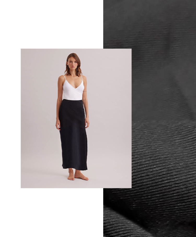 Discover the NOVELA Longline Black Tactel Maxi Skirt