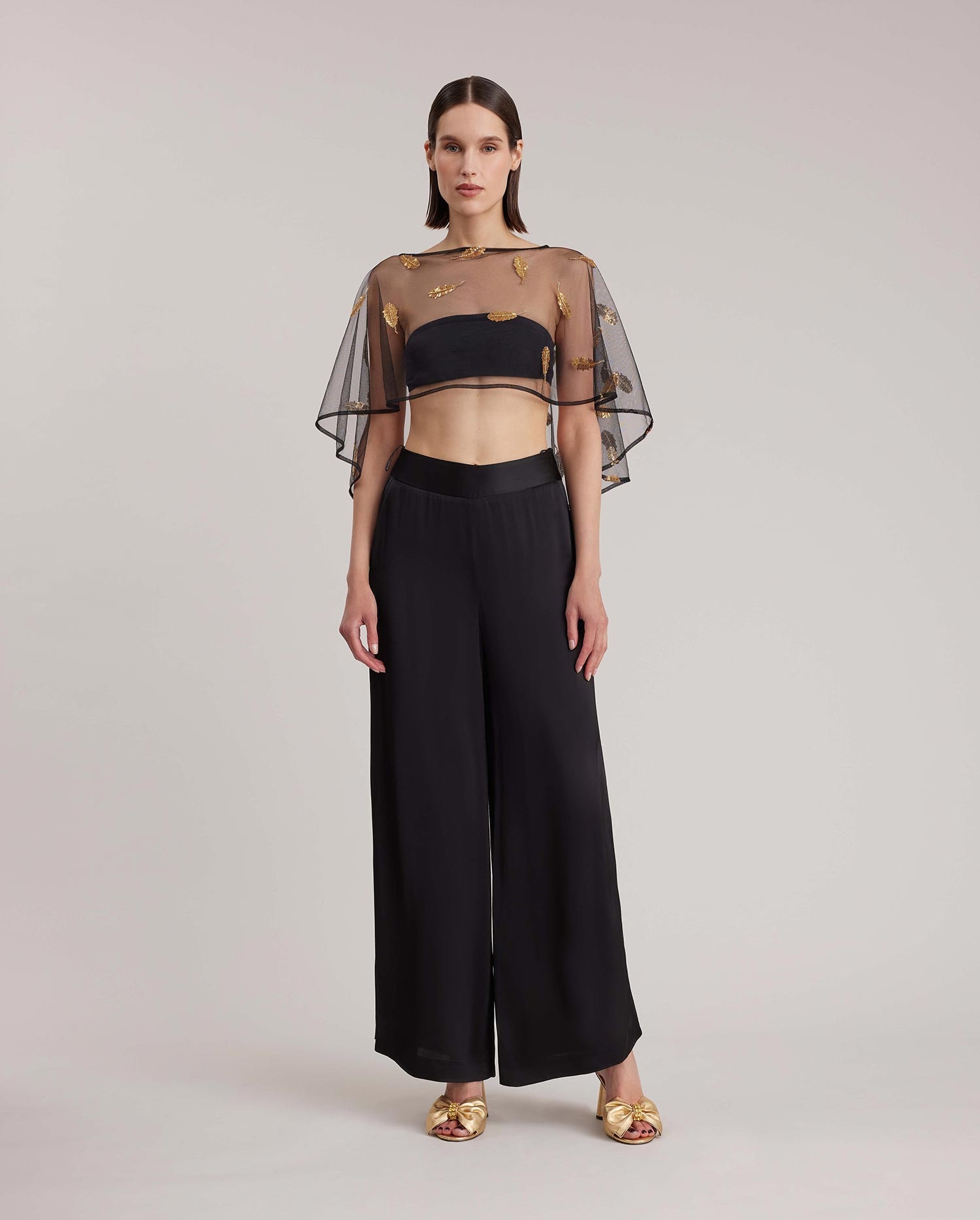 Discover the LEA Sheer Mesh Cape Embroidered With Gold Sequins 
