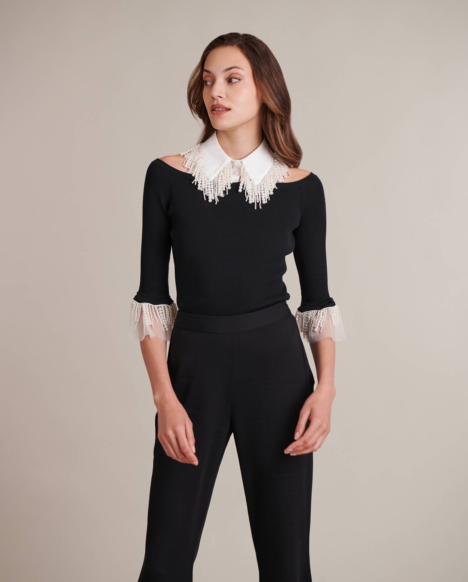 Discover the essence of elegance with our exquisite collection of tops