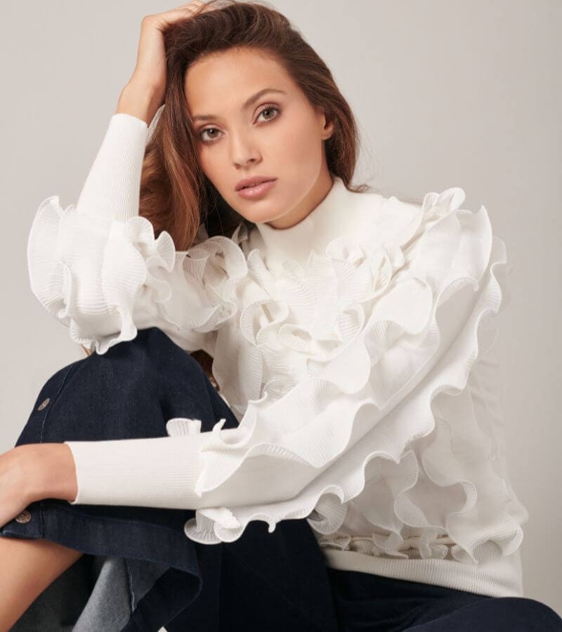 Discover the SIDALINE Long sleeve knitted sweater with pleated ruffles in white from ANNE FONTAINE